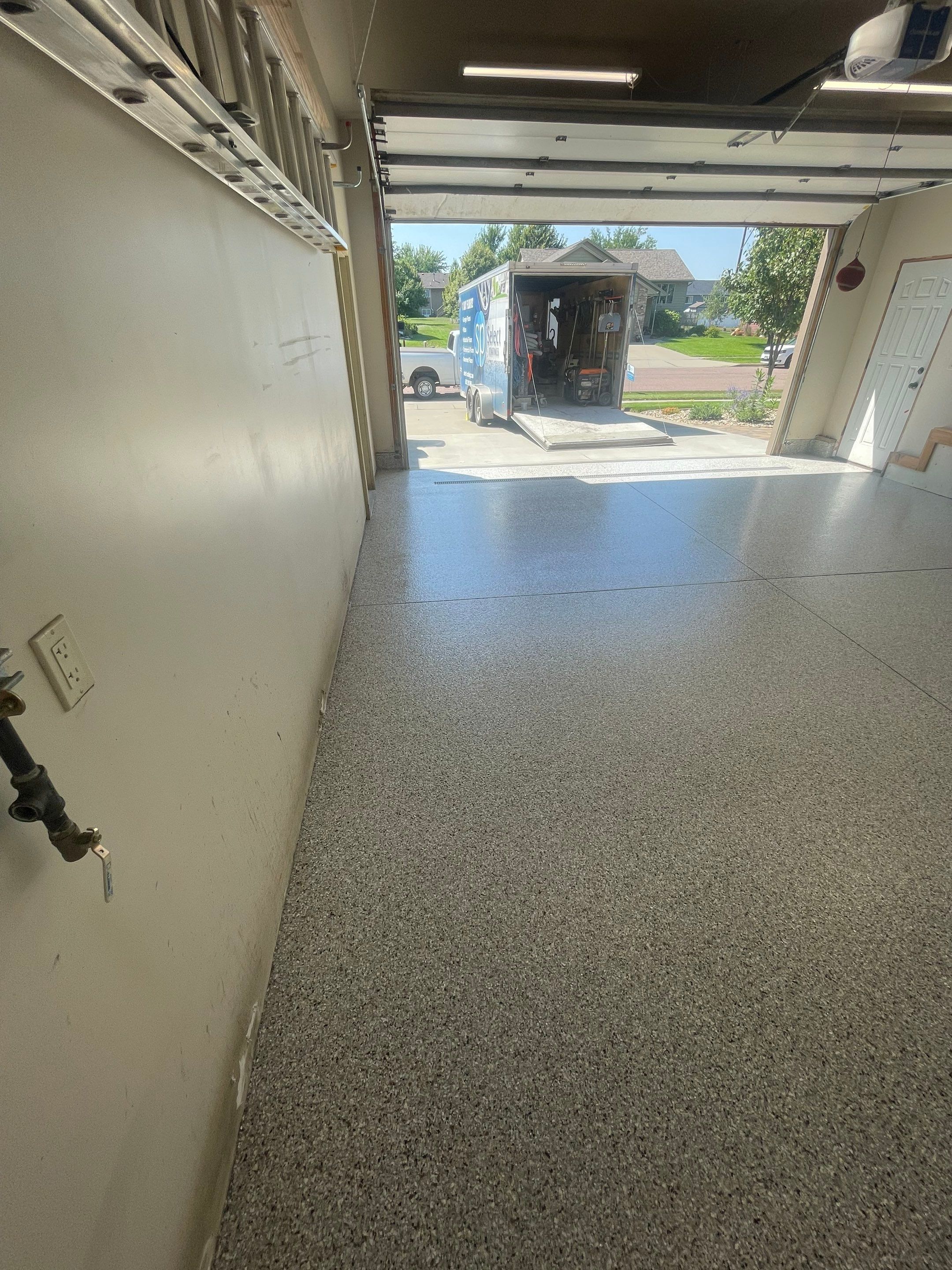 Multi-Stall Garage Floor Coating Installation in Sioux Falls by Select Painting, Coatings & Garage Cabinets
