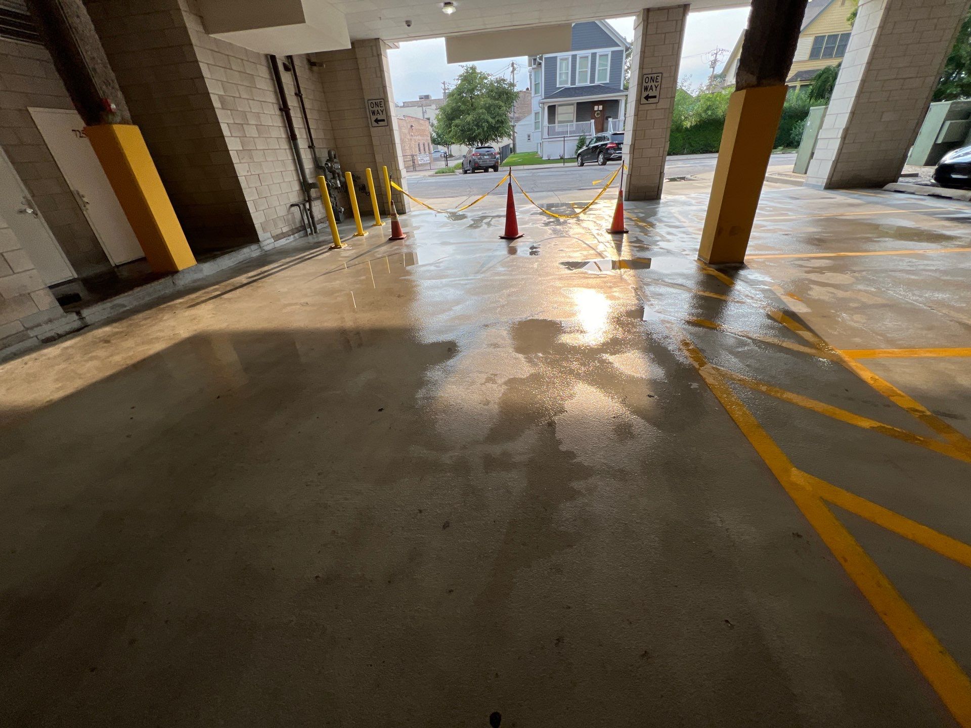 Parking garage using Hot water by Northern Power Washing LLC.