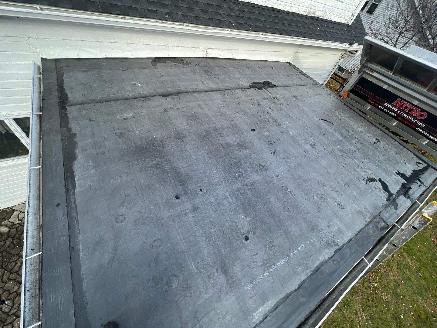 Residential Roofing Installation using 60 mil rubber roof by Nitro Roofing and Construction