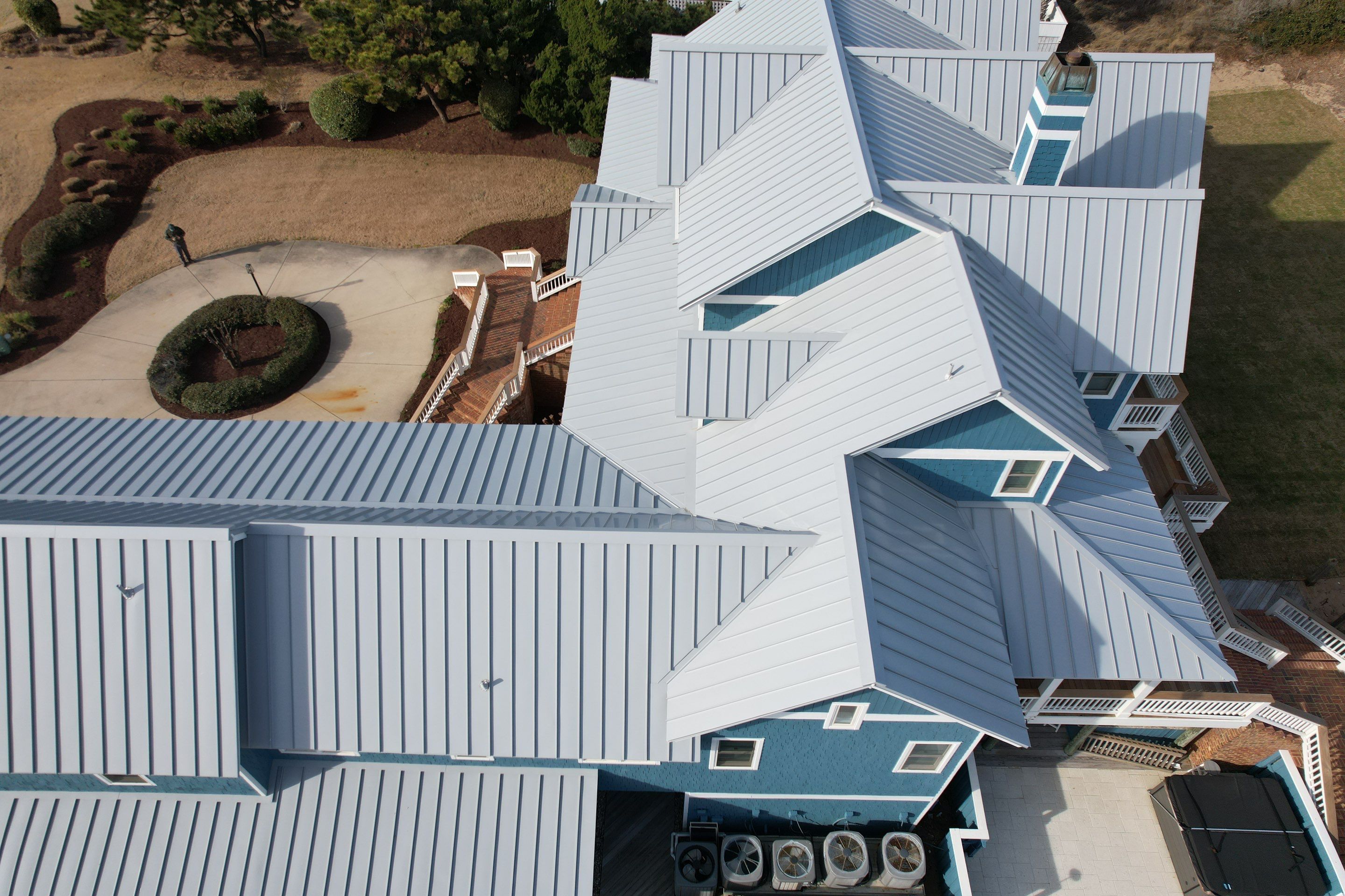 Large Metal Roof Transformation by Gallop Roofing & Remodeling, Inc.