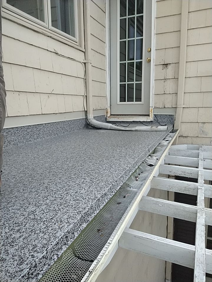 Residential Roofing Installation, Dec-tek walk-out porch roof, siding on garage by Absolute Roofing and Construction
