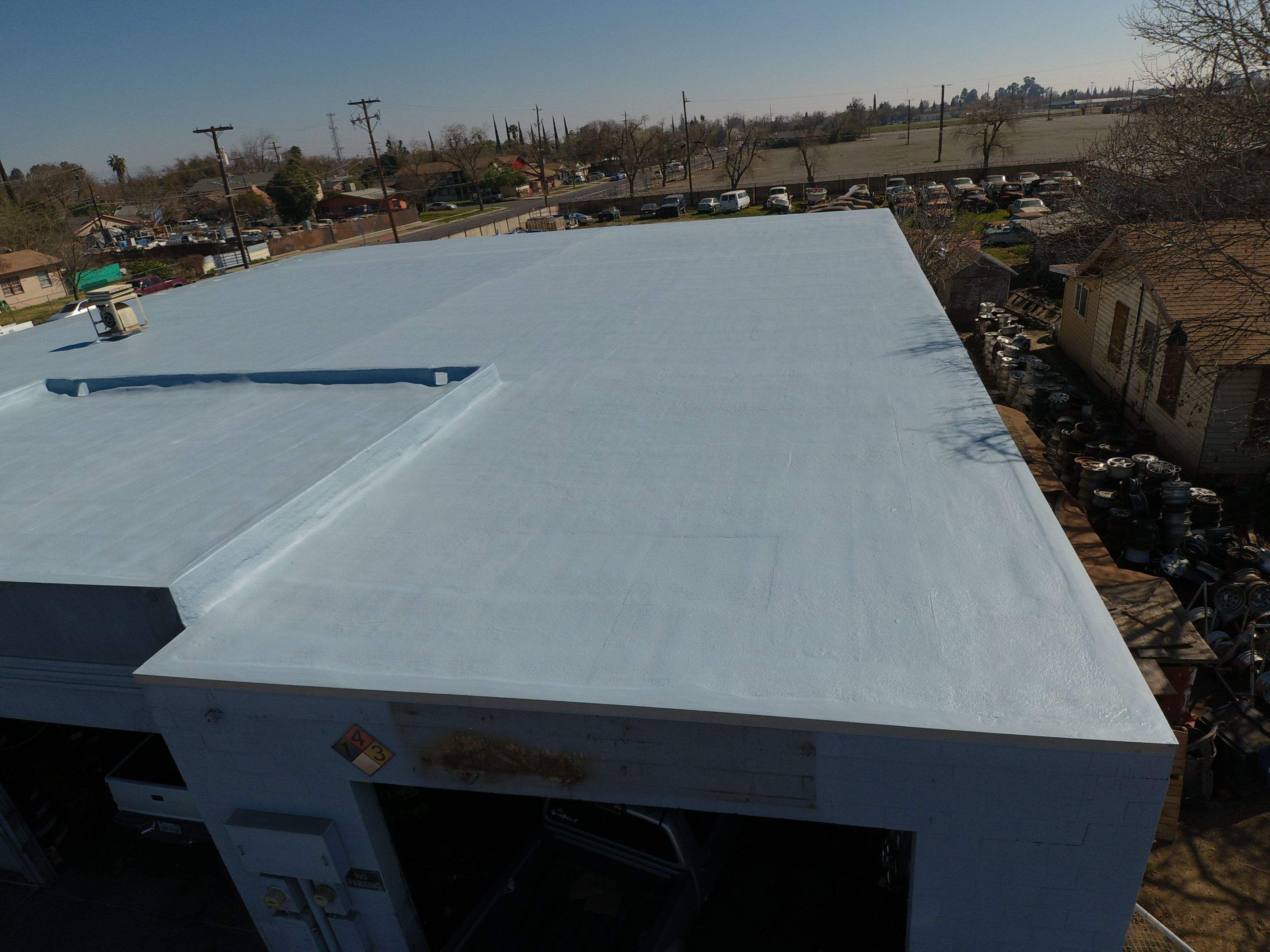 Spray foam and coatings using Conklin Benchmark/PUMA XL coatings and spray foam by Straight Edge Roofing Inc