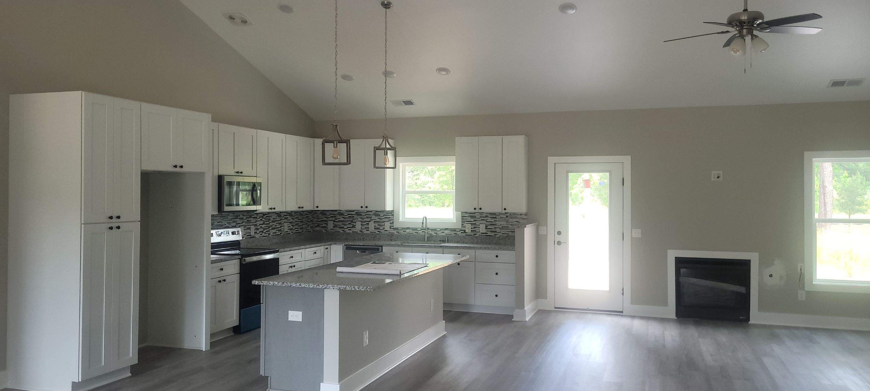 New Home Construction using brick and vertical vinyl by Cornerstone Home Builders, LLC