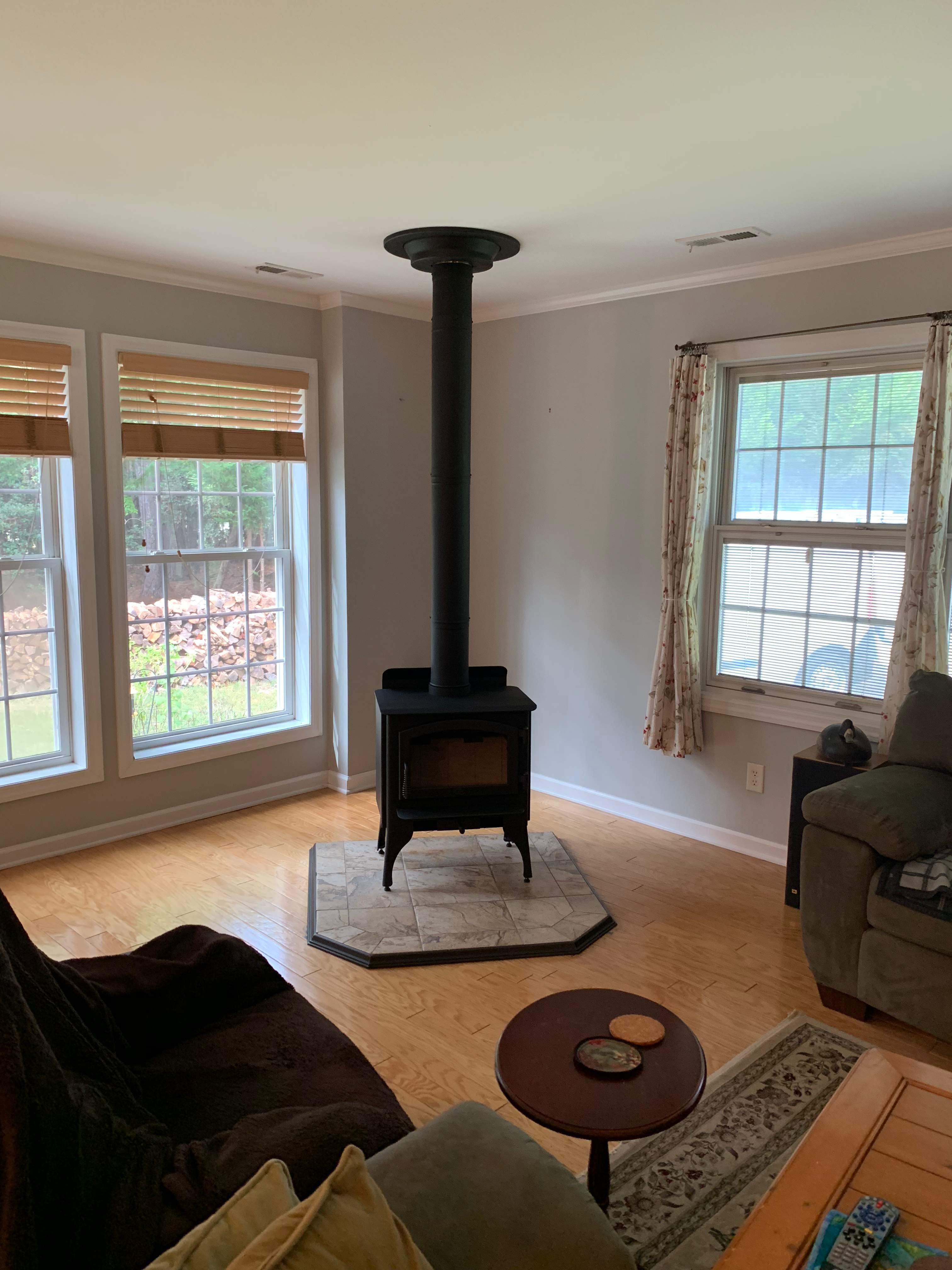 Freestanding Wood Stove by Premier Chimney and Roofing