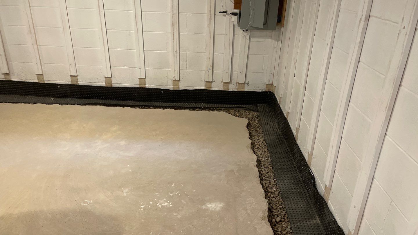 Interior Drain Tile & Buried Discharge in St. Anthony, MN by Waterproofing Northeast