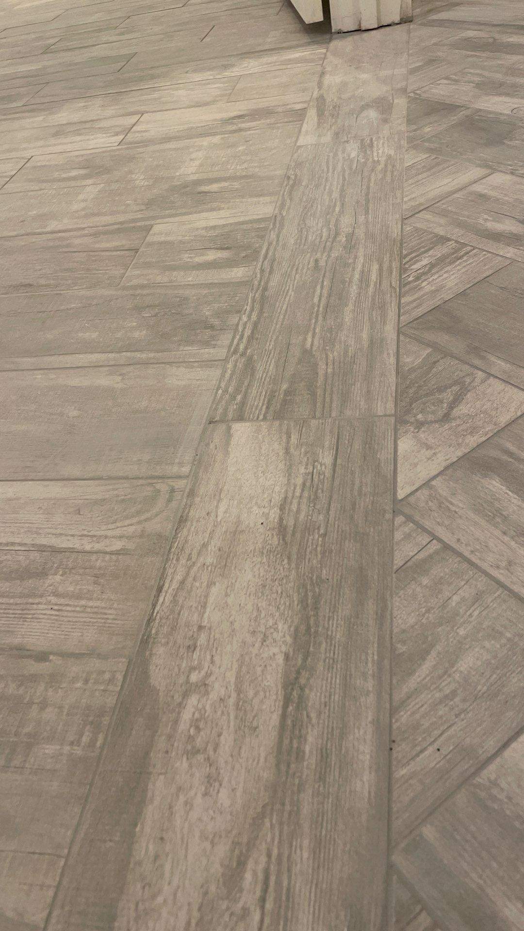 Herringbone basement floor by Footprints Bath and Tile of East Atlanta