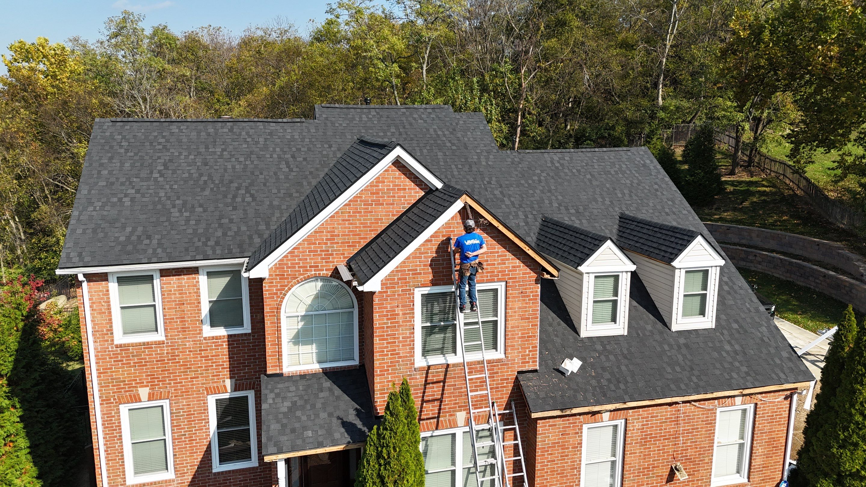 Charcoal Black Re-Roof & Gutters by Royal House LLC