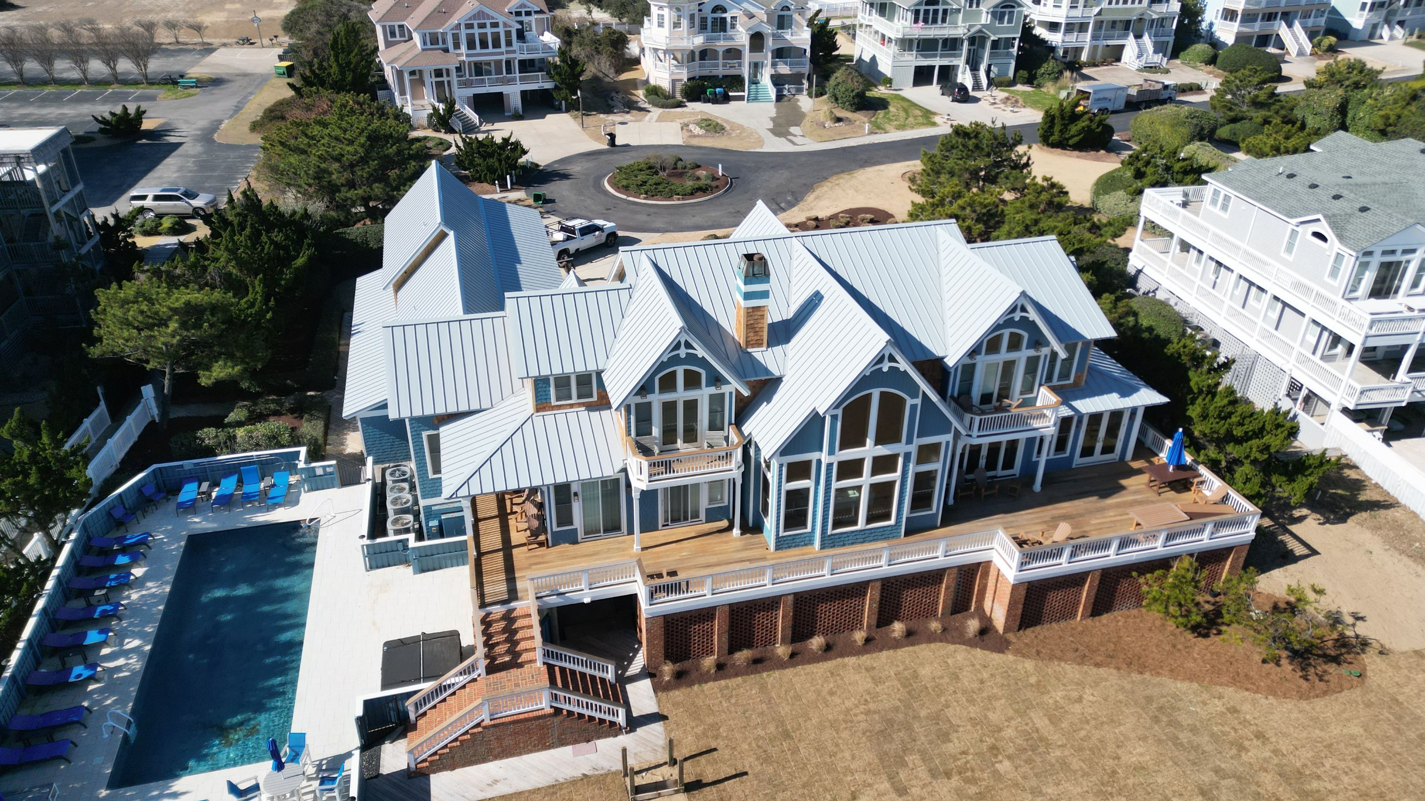 Large Metal Roof Transformation by Gallop Roofing & Remodeling, Inc.