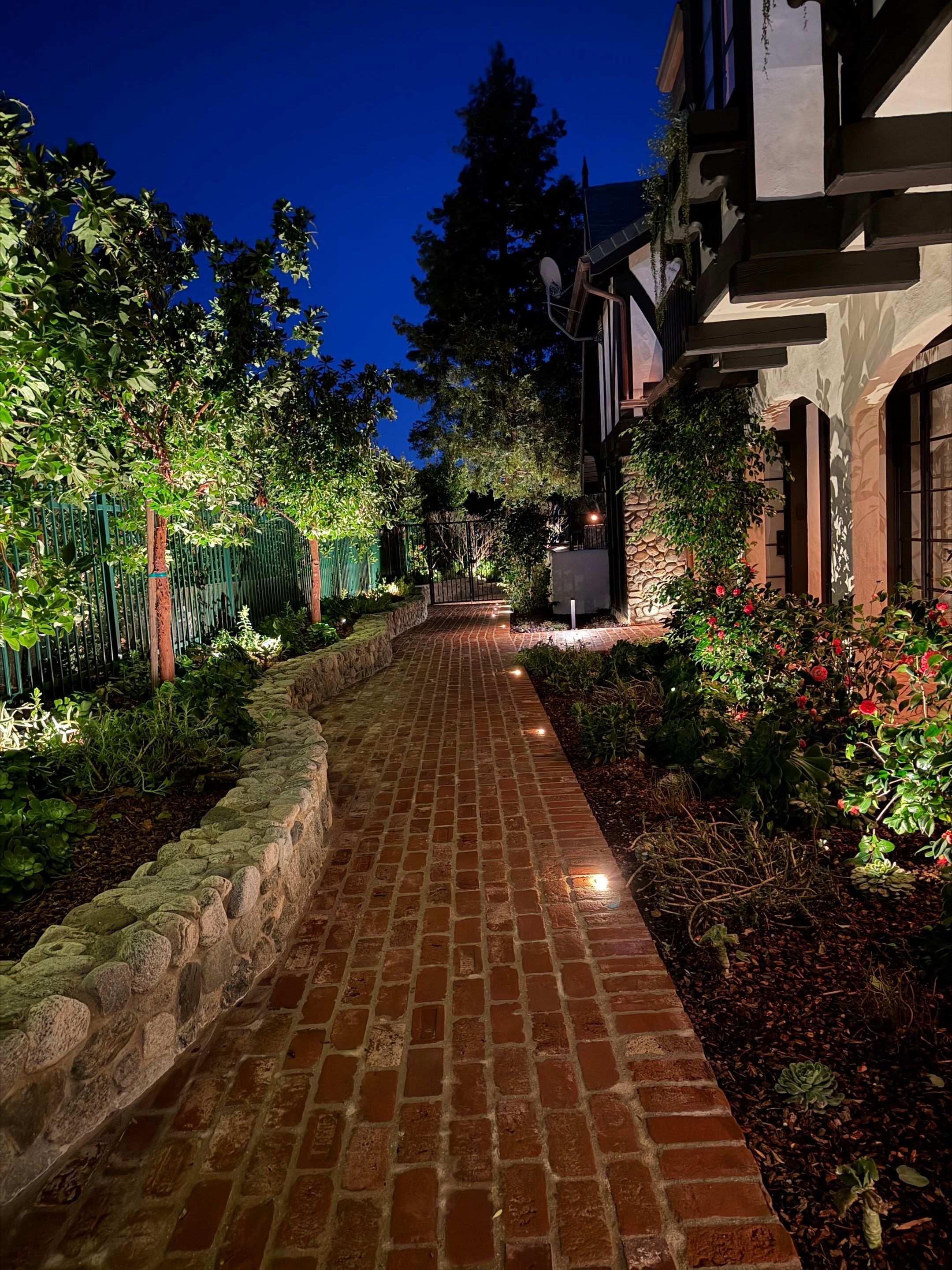 Tudor Estate Landscape Lighting with Integrated Stone Step Illumination by Outdoor Lights + Shades