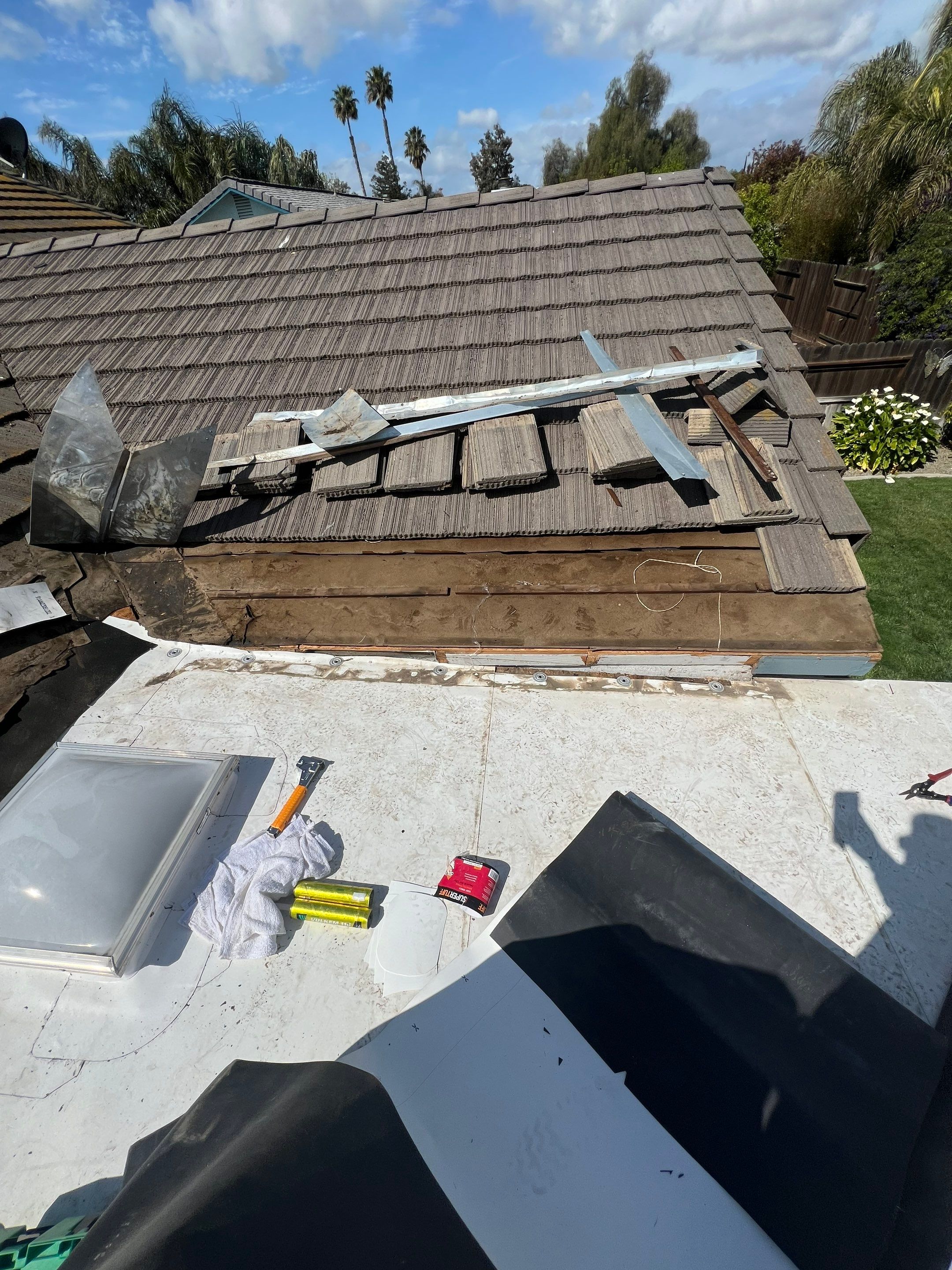 Single-ply roofing system on porch using TPO 60 mil by Straight Edge Roofing Inc