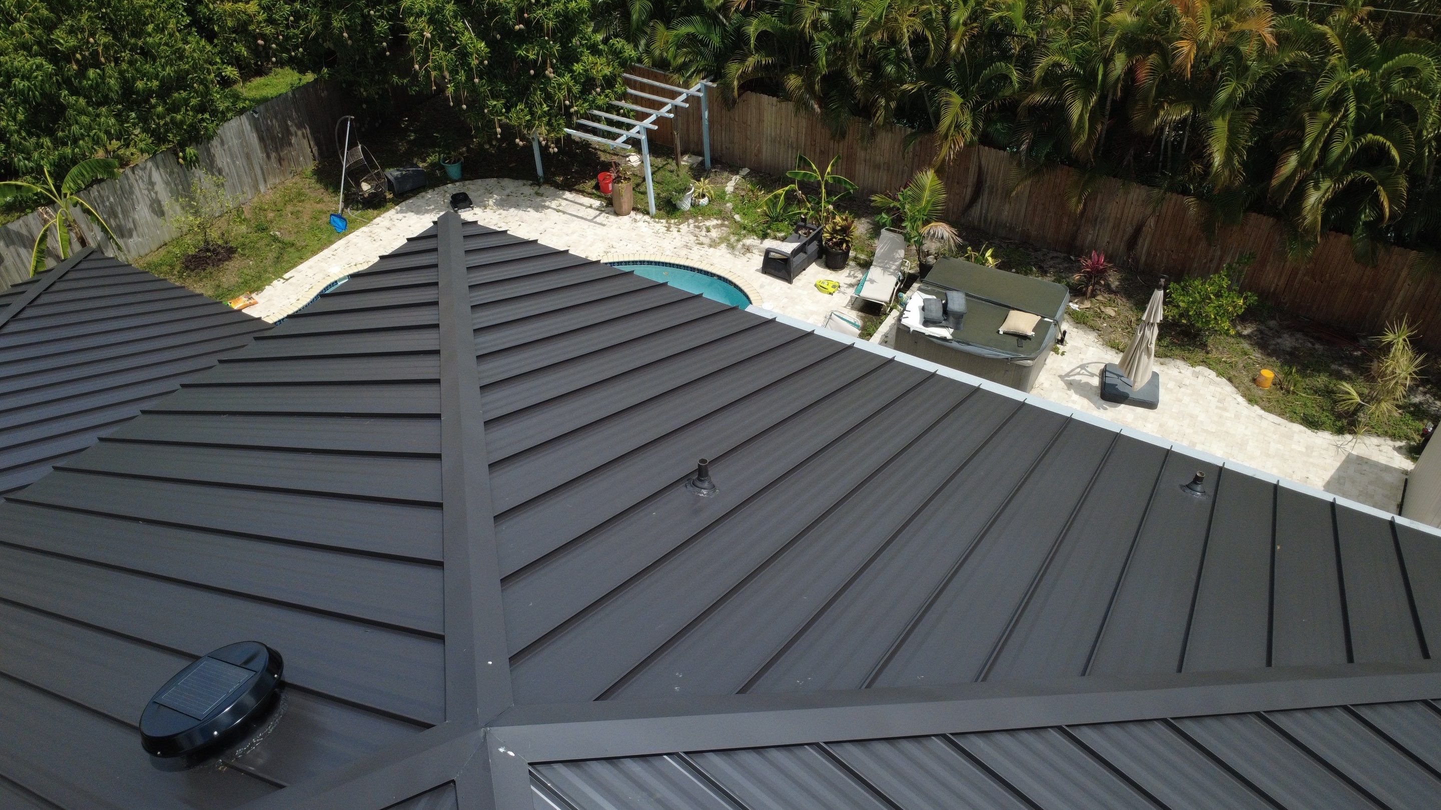 Residential Roofing Installation using 1.5'' Mechanical Seam by BLUES BROTHERS ROOFING