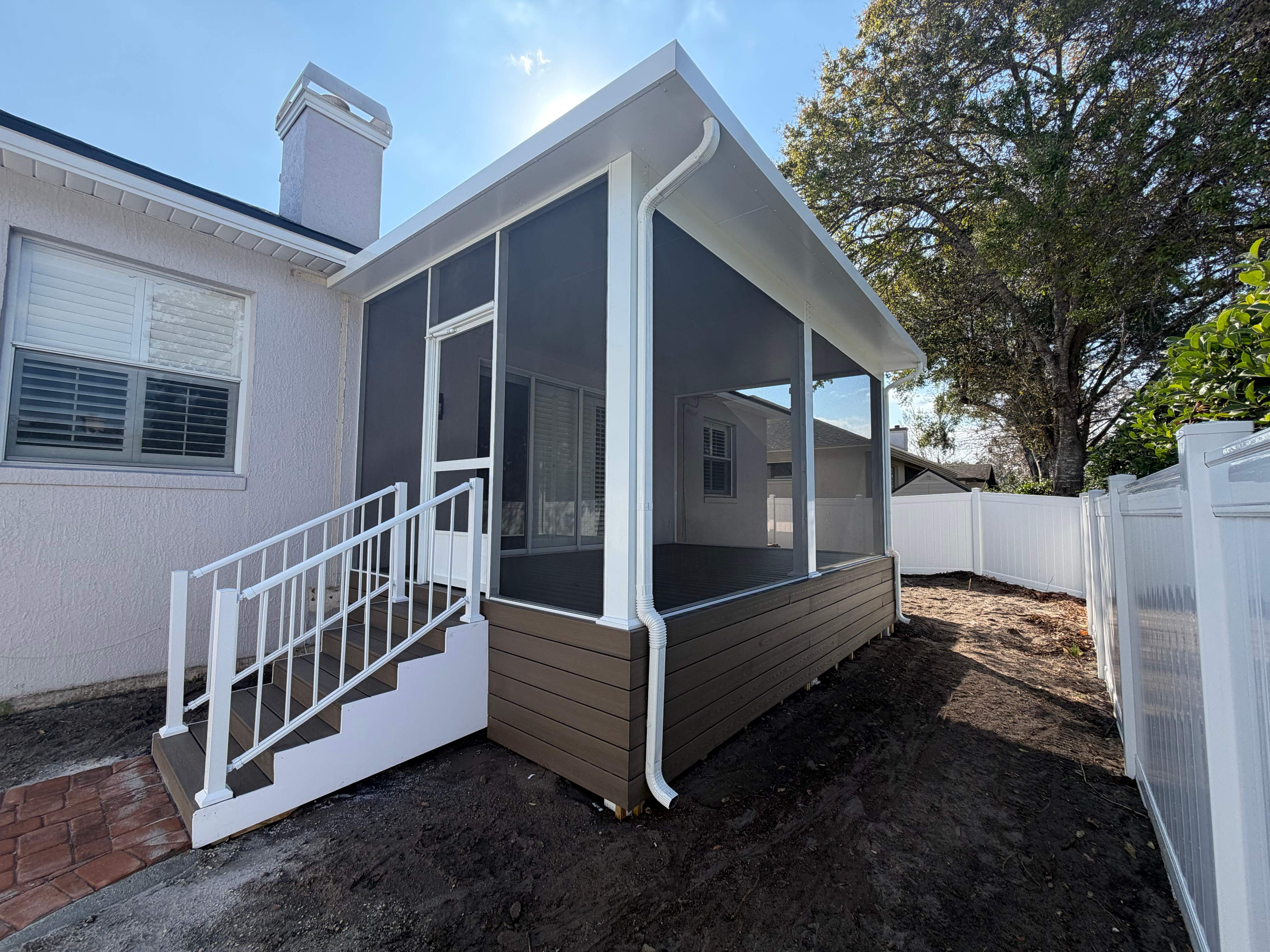 The Complete Backyard Retreat: Insulated Screen Room & Composite Deck by Orlando pergolas