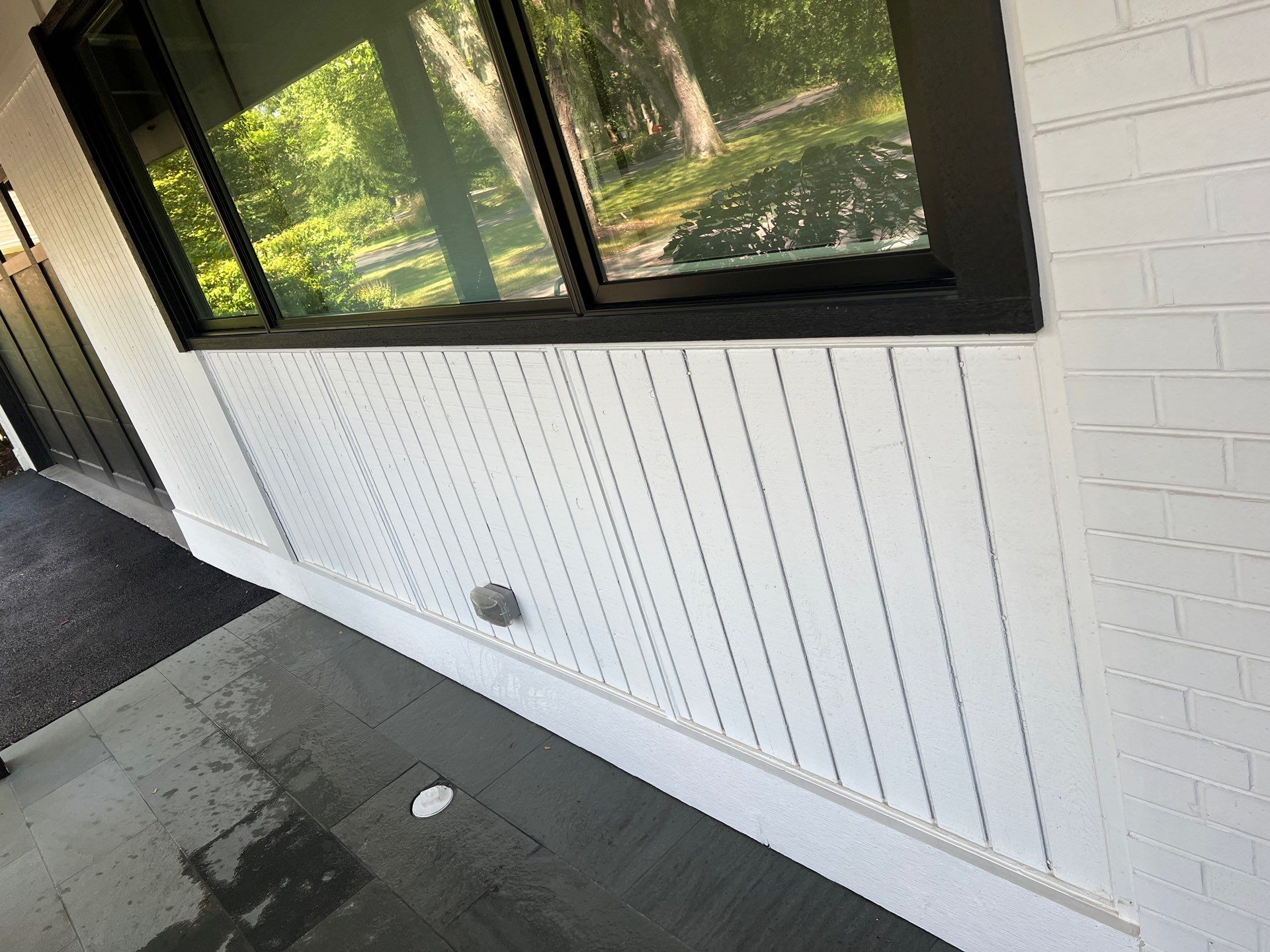 Complete Exterior House, Bluestone & Garage Floor Cleaning by Northern Power Washing LLC.