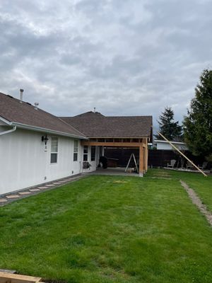 Residential patio roof extension with IKO Dual Brown shingles