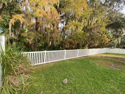 Bradenton, FL 6 ft. Tall White Vinyl Privacy Fence Installation and 4 ft. Spaced Picket Vinyl 