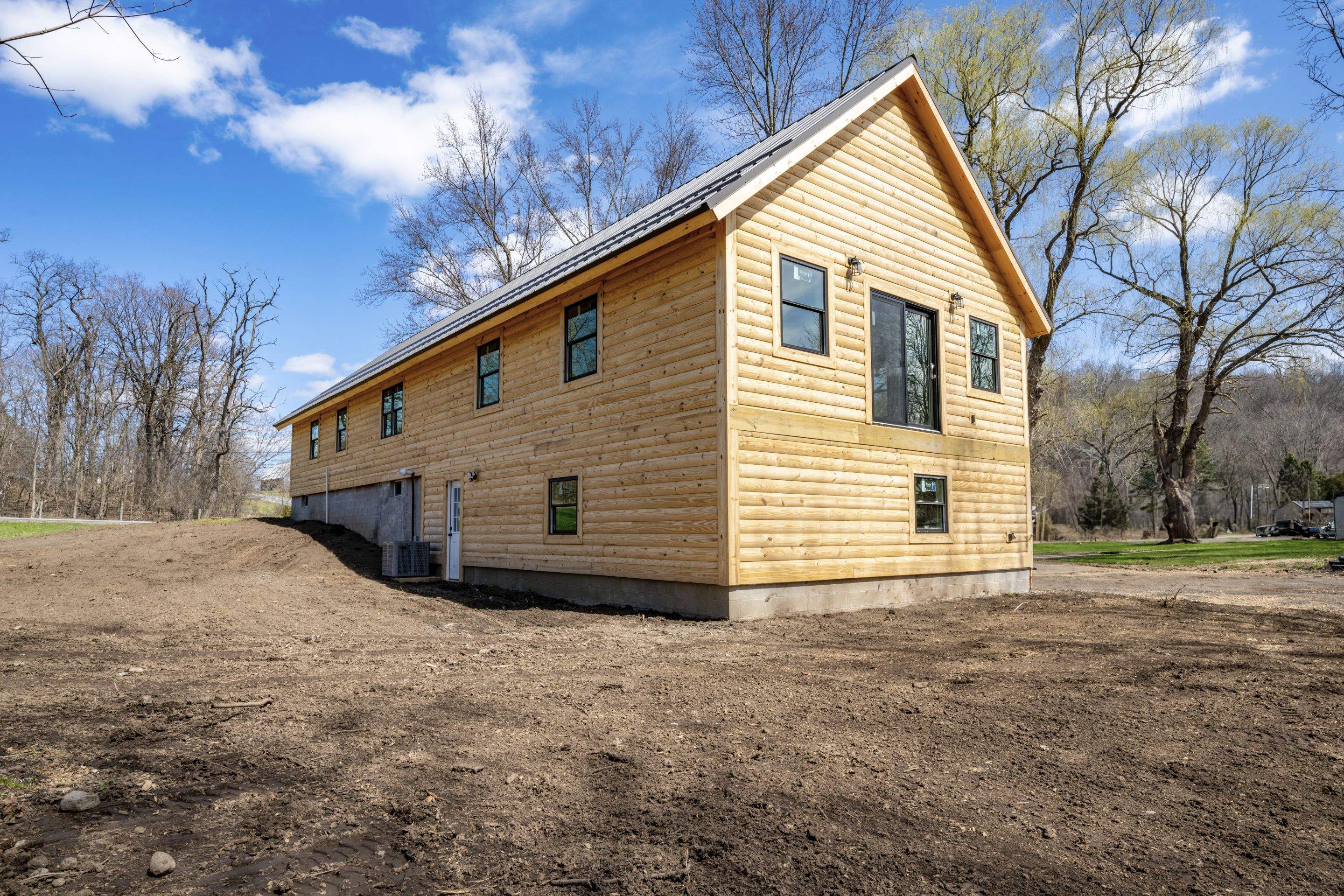 New Addition to Home using Log Cabin Siding  by Horst Custom Homes 