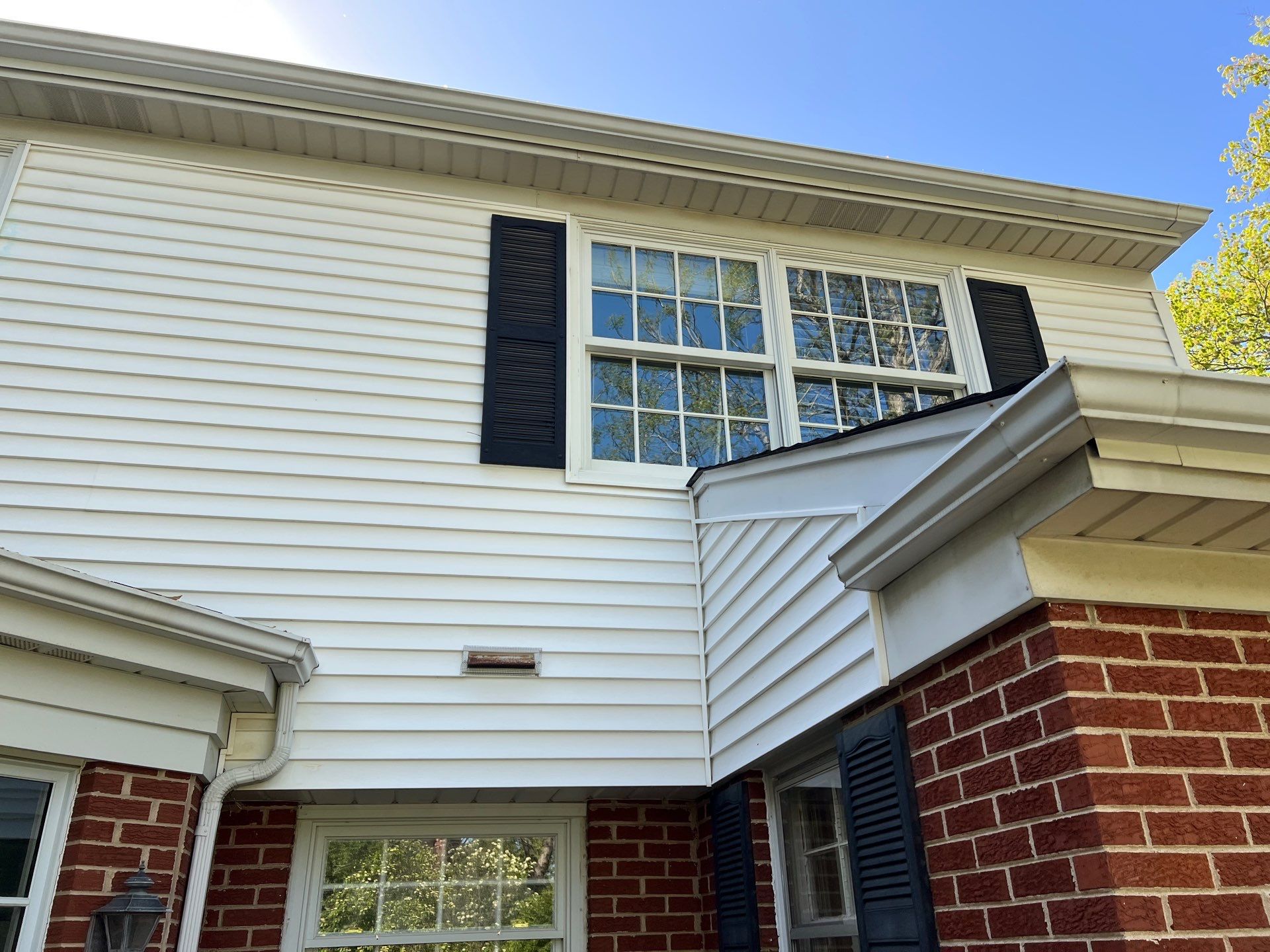 Housewashing  using Algaecide, soft wash soap by Northern Power Washing LLC.