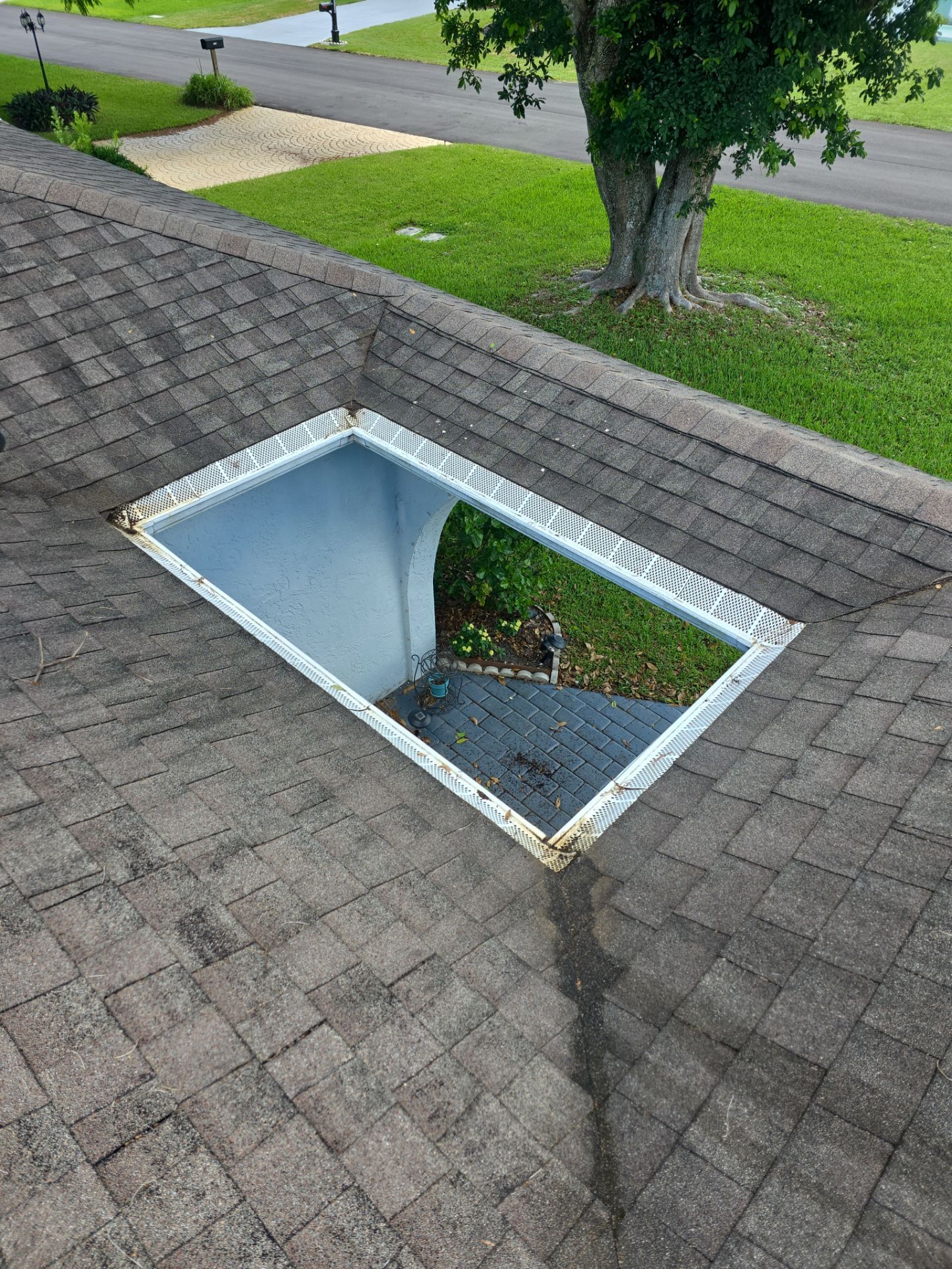 REPLACE NON APPROVED SKYLIGHT ALONG WITH CLOGED GUTTER by Morton Roofing, Inc.