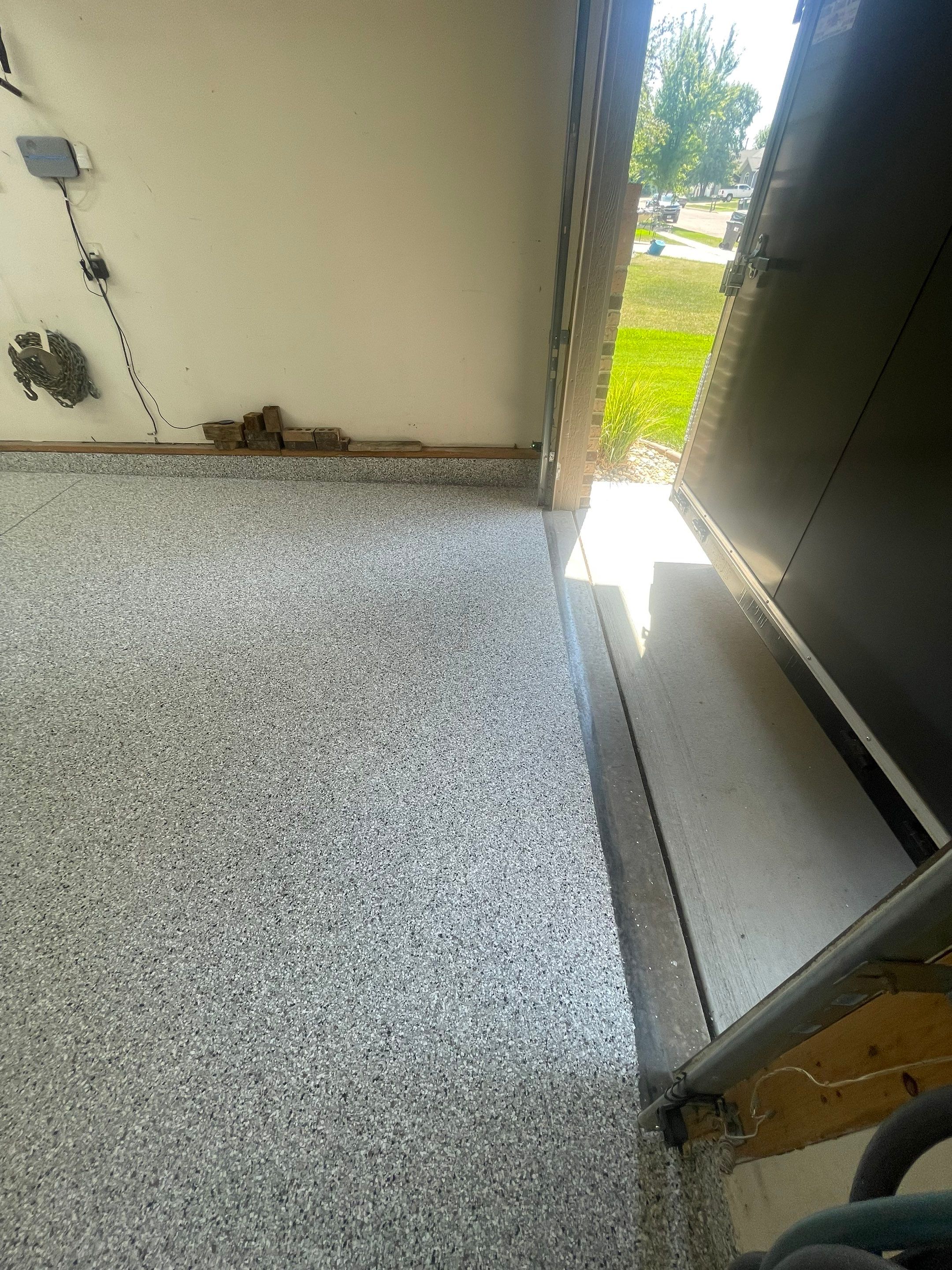 Multi-Stall Garage Floor Coating Installation in Sioux Falls by Select Painting, Coatings & Garage Cabinets