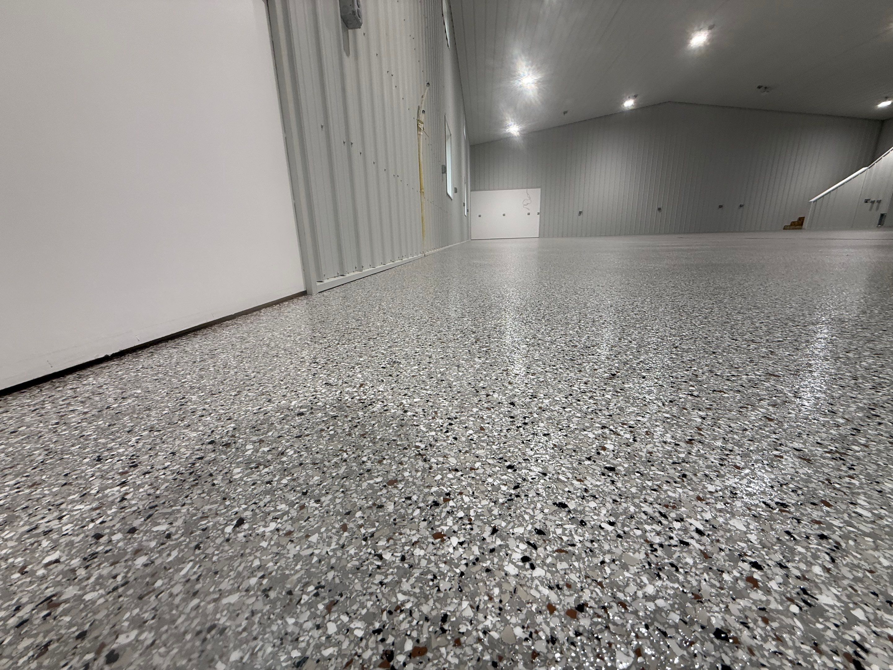 Custom Speckled Floor Coating for Large Montrose Shop by Select Painting, Coatings & Garage Cabinets