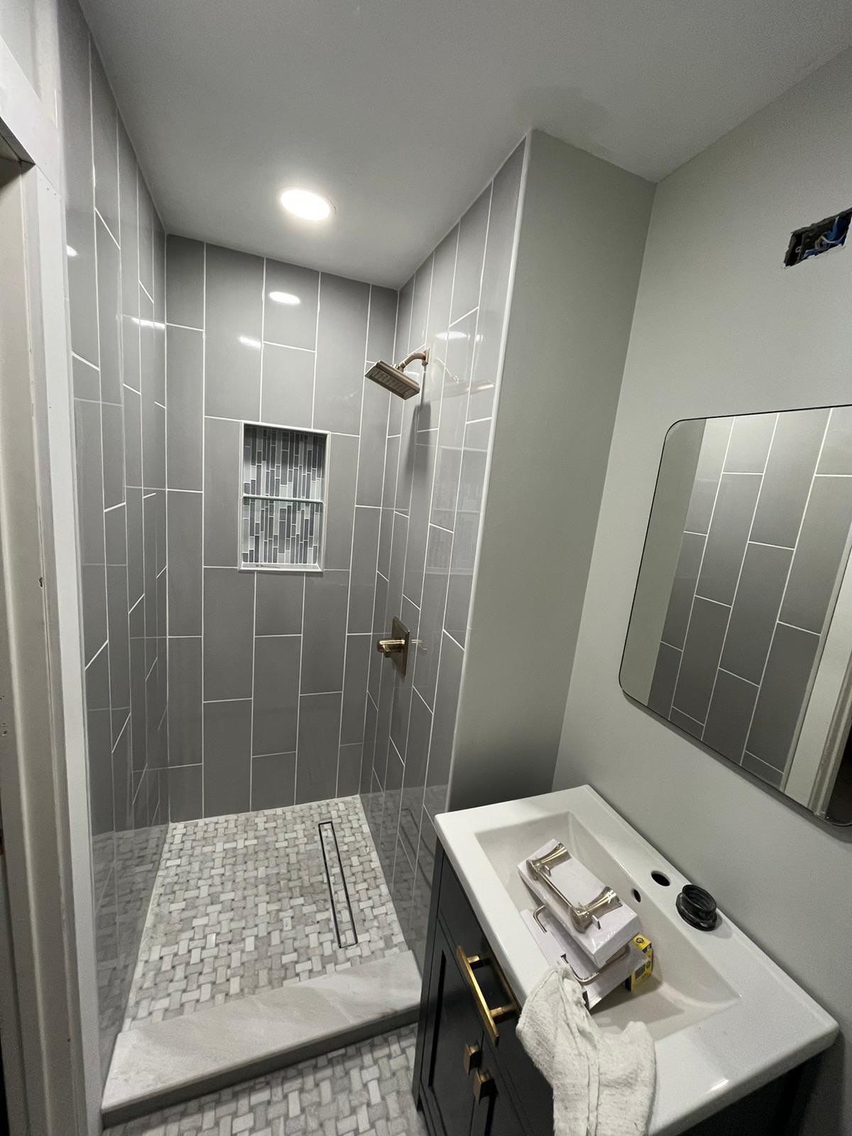 Bathroom Remodel using Tile by Home Concepts Construction