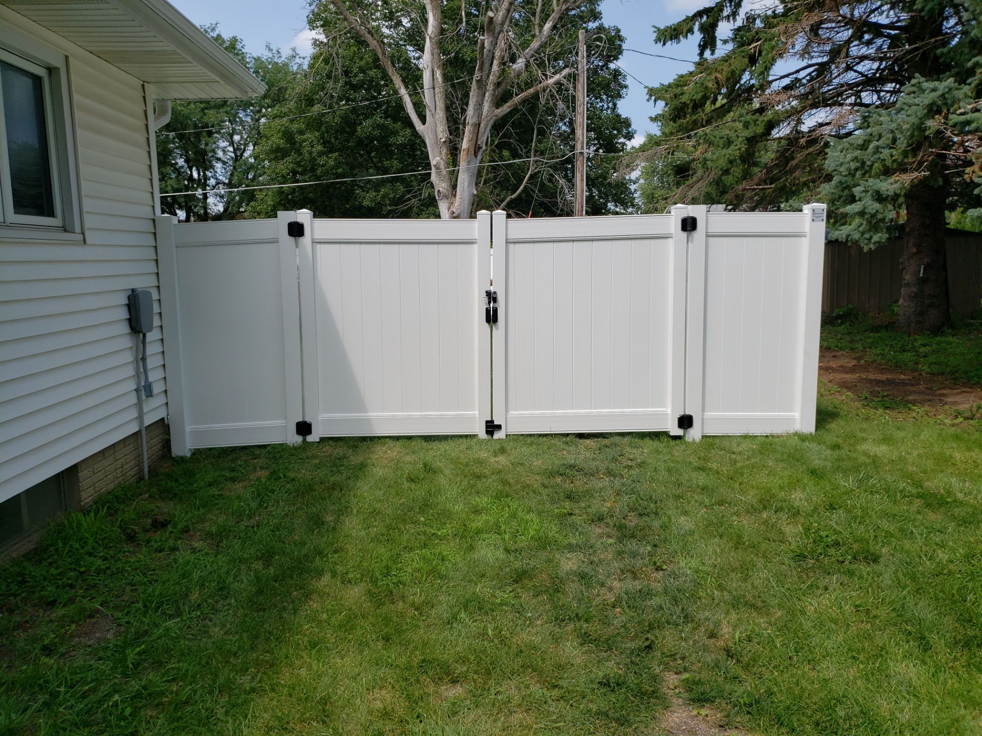 White Vinyl Privacy Fence Installation in Grundy Center by Perfect Picket Fence and Stain