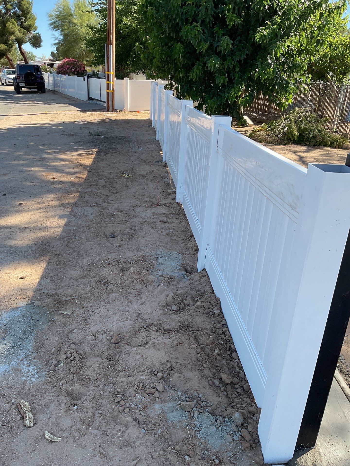 4ft White Vinyl Fence with Solar Power Motorized Gate by Fence Guys Inc.