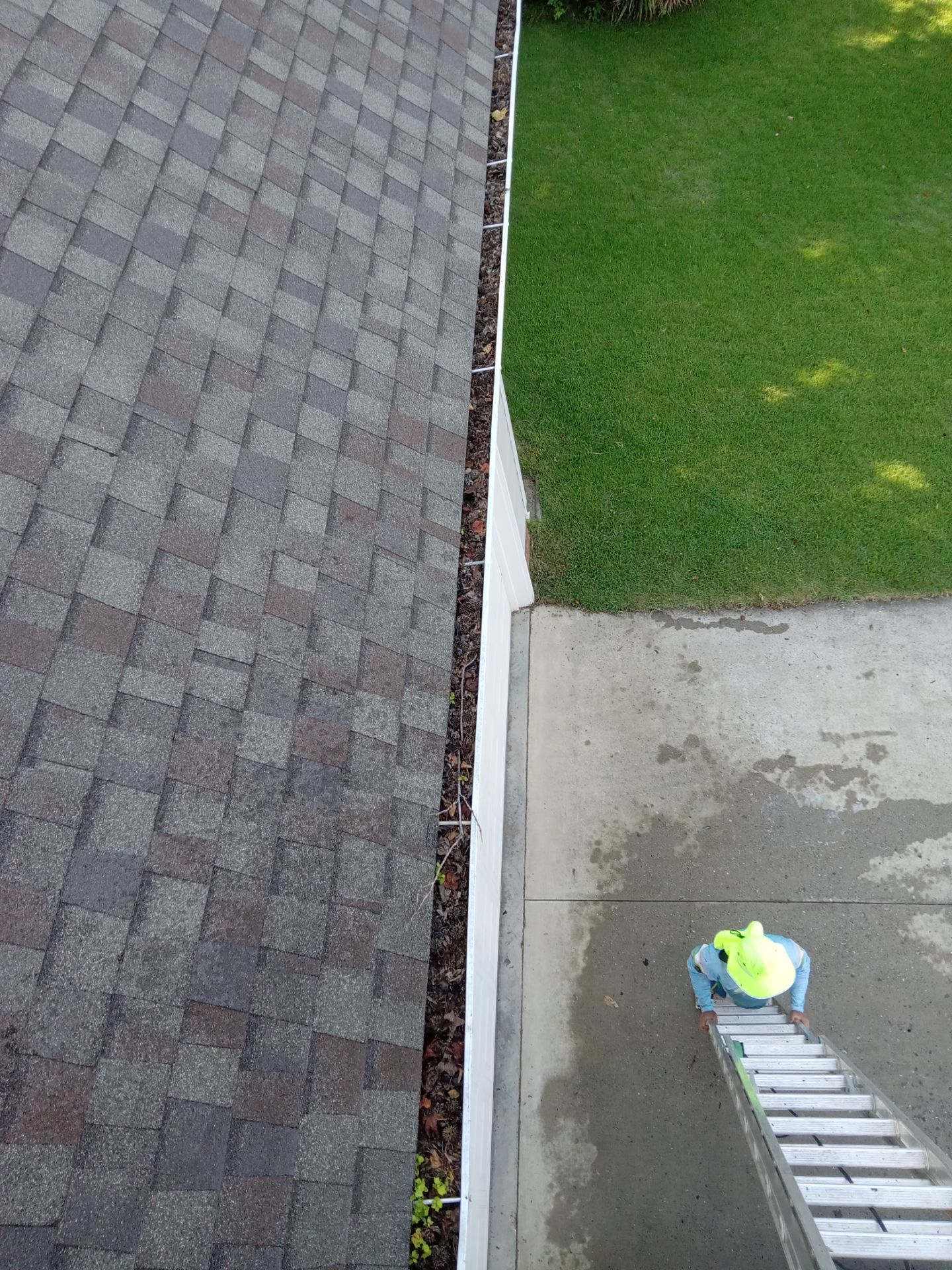 pressure washing concrete driveway cleaning to remove dirt buildup and stains restoring surface appearance