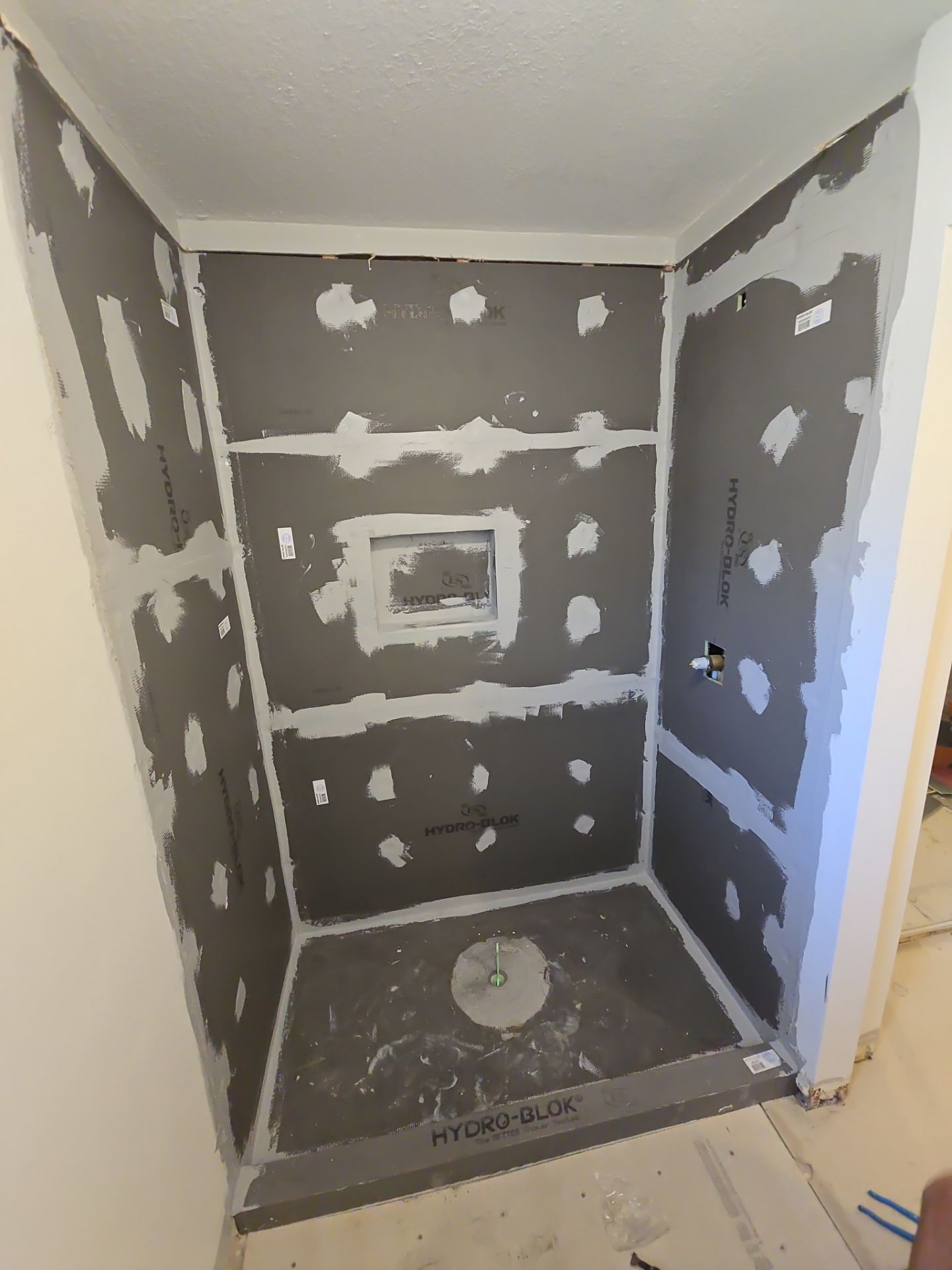 Fragmento tile bathroom floor and shower walls by The Shower Company