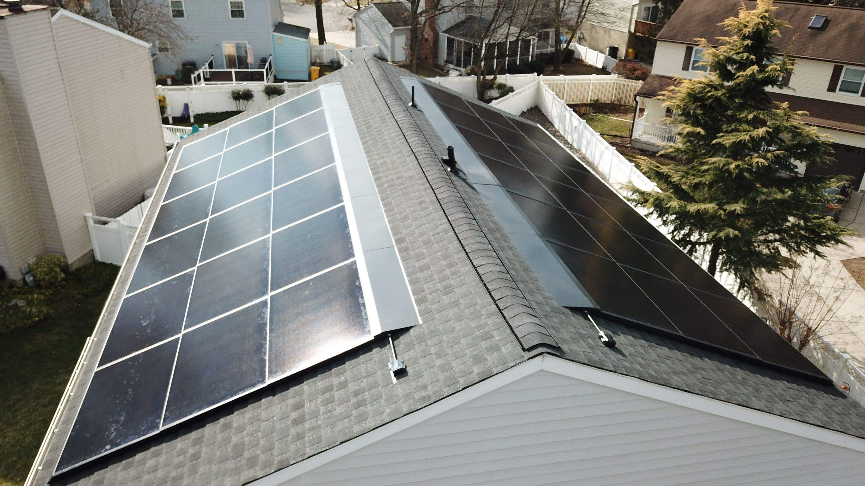 Roof Replacement with GAF Decotech integrated solar panels by American Home Contractors