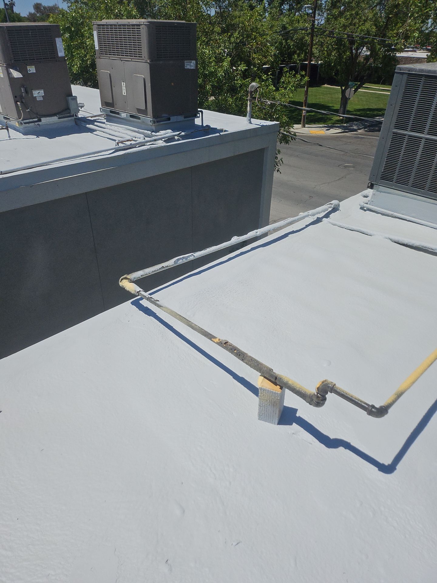 Foam Refurbish using General Coatings acrylic coatings and spray foam by Straight Edge Roofing Inc