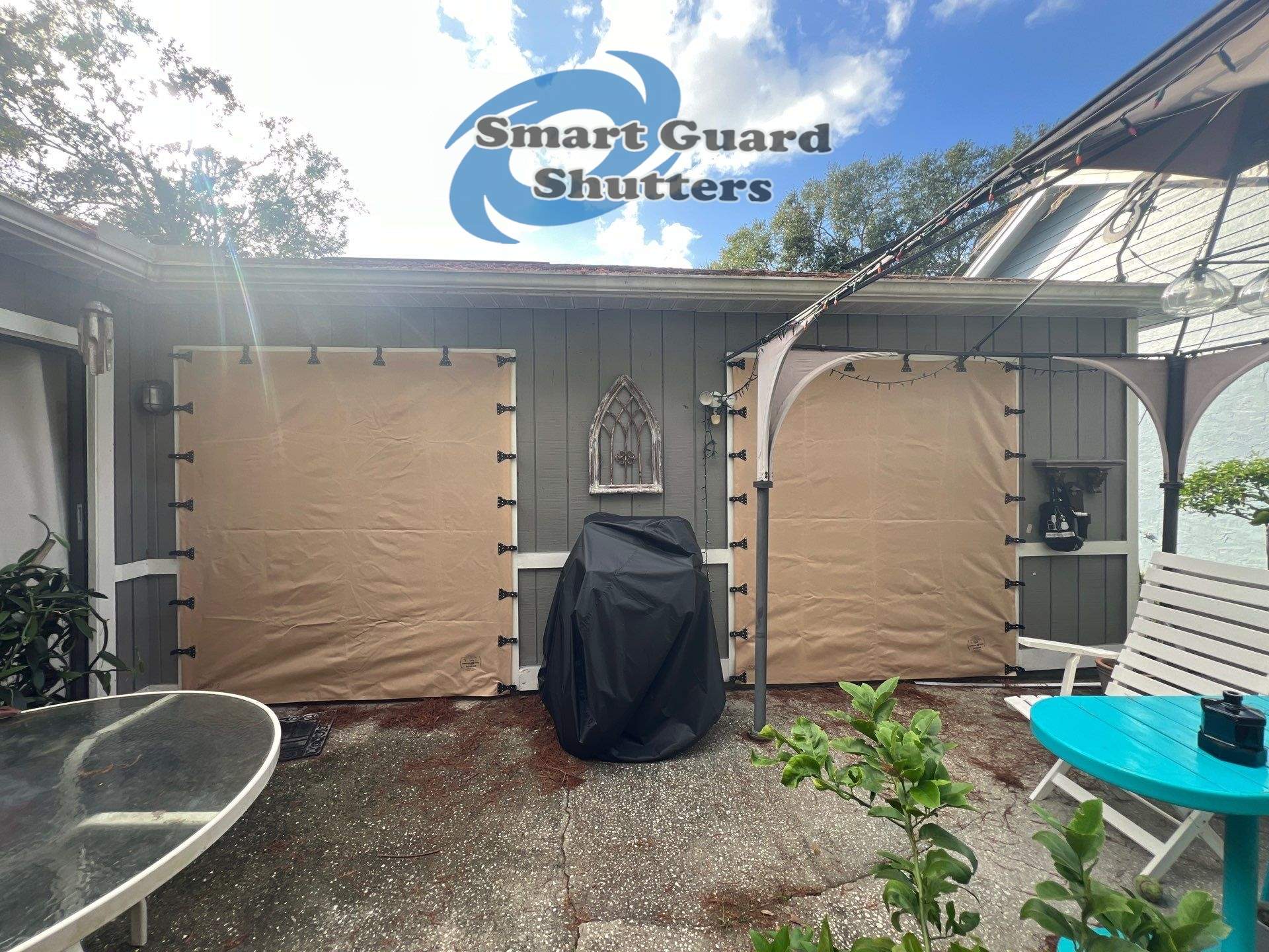 AstroGuard Hurricane Fabric in Tan & Impact Bahamas in Water Blue by Smart Guard Shutters
