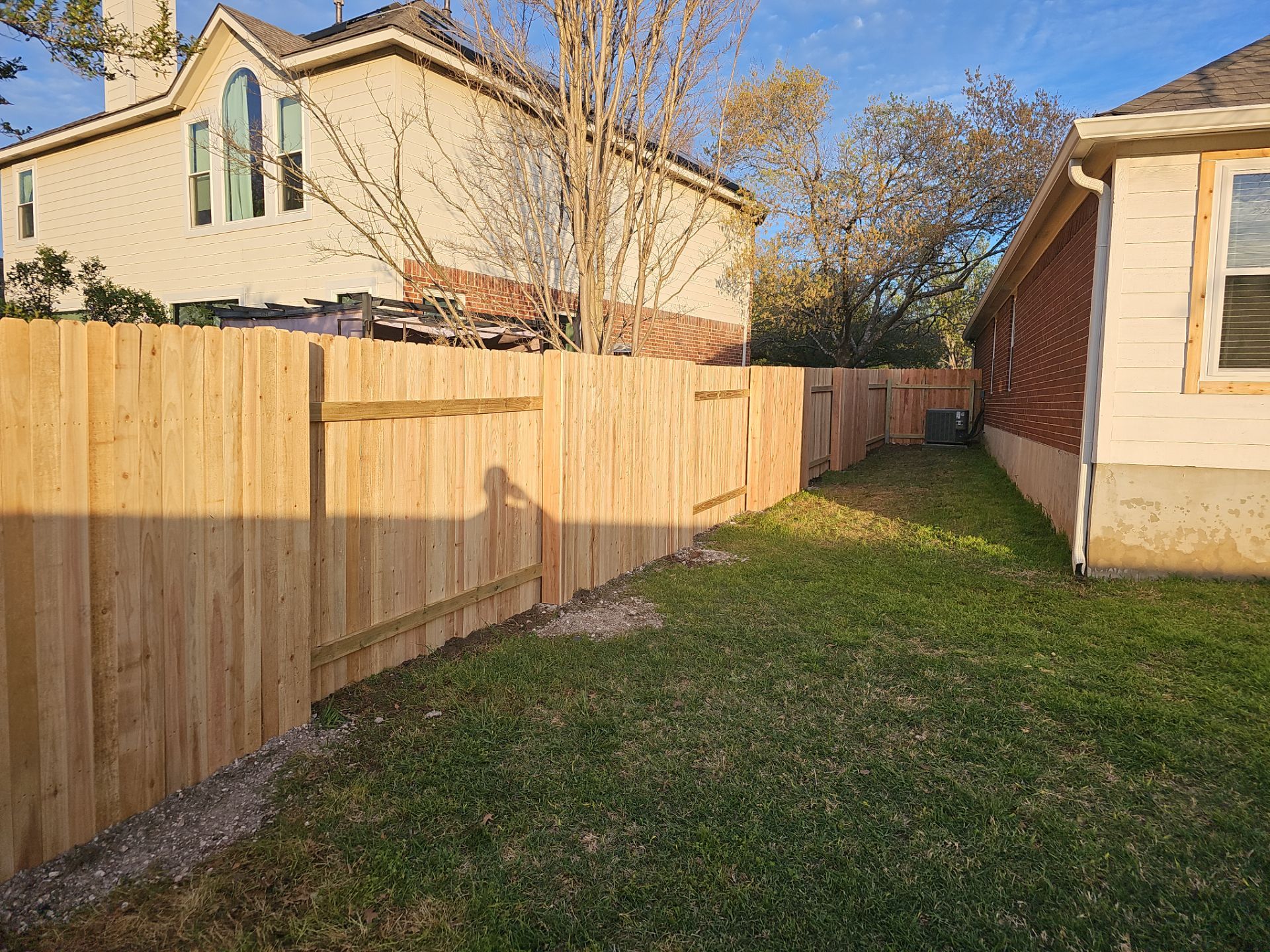 Fence Installation using Cedar Pickets by DeZign Roofing & Exteriors