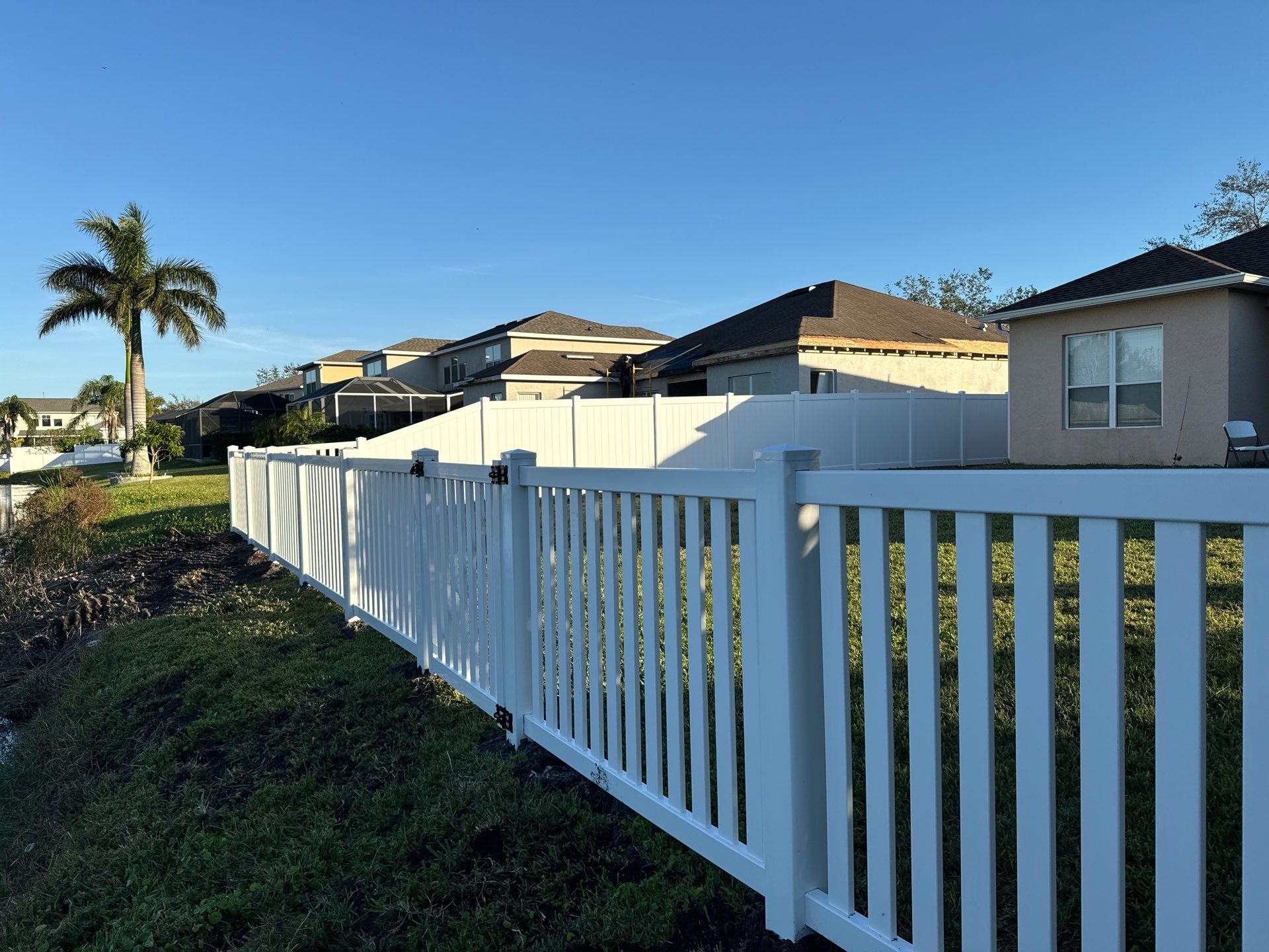Vinyl Picket Fence Installation using 6Ft White Vinyl Privacy Fence with a 4Ft White Clearwater Picket Fence by Asap fence and gates, LLC