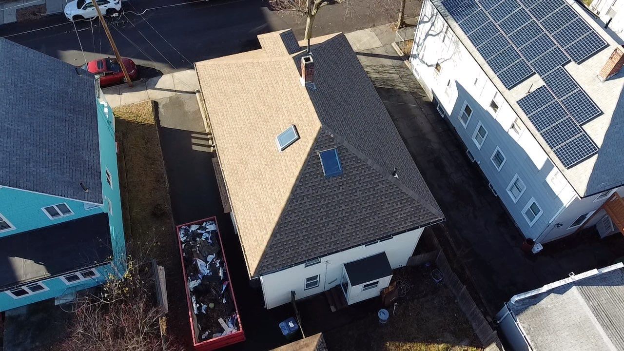 Roof Installation Roof Type: Hip Roof  Multi Family Home- 2 Story by Delarosa Construction & Design