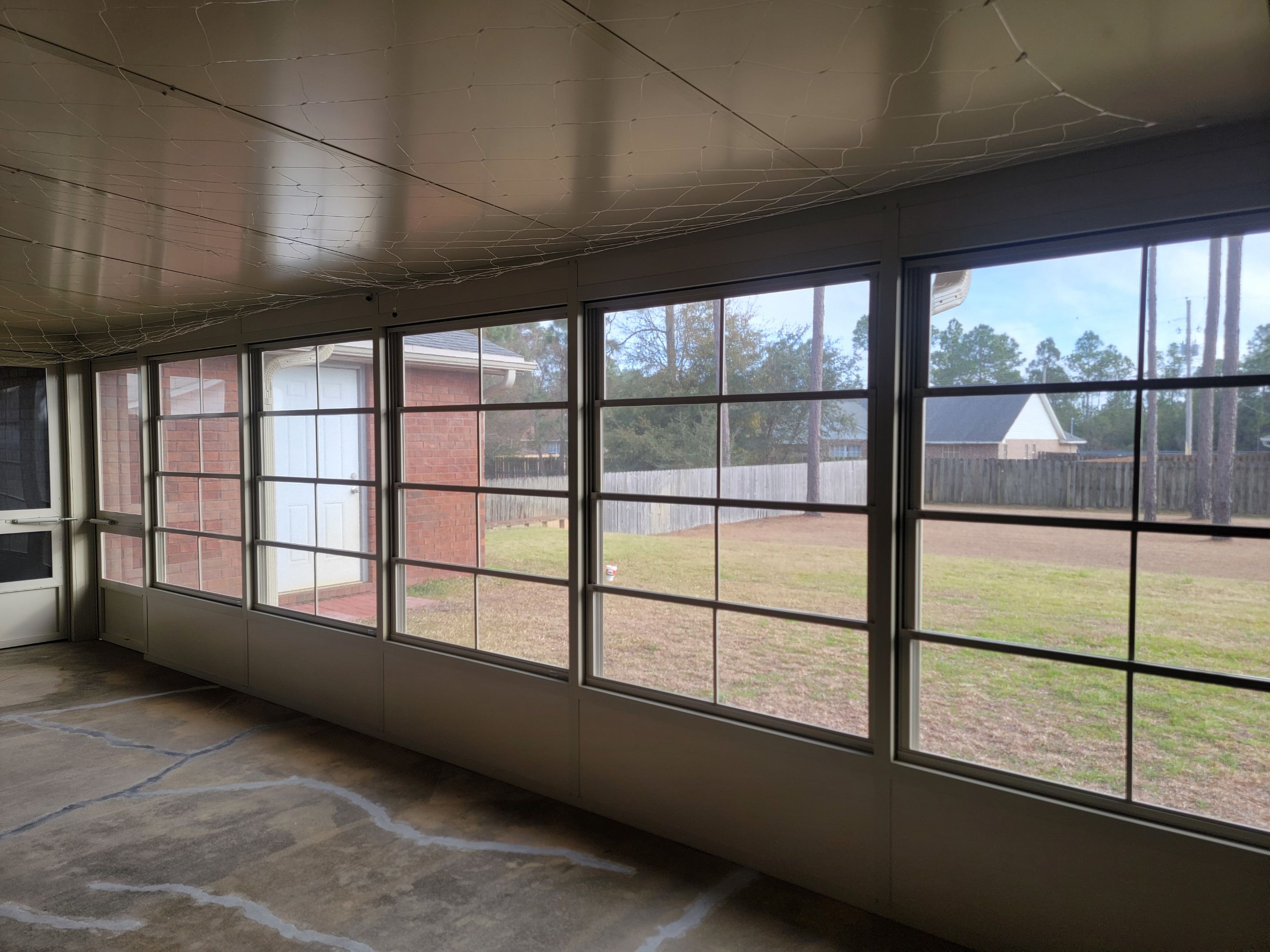 Enclosure w/Vinyl Windows using Colorbeam by Titan Sunrooms