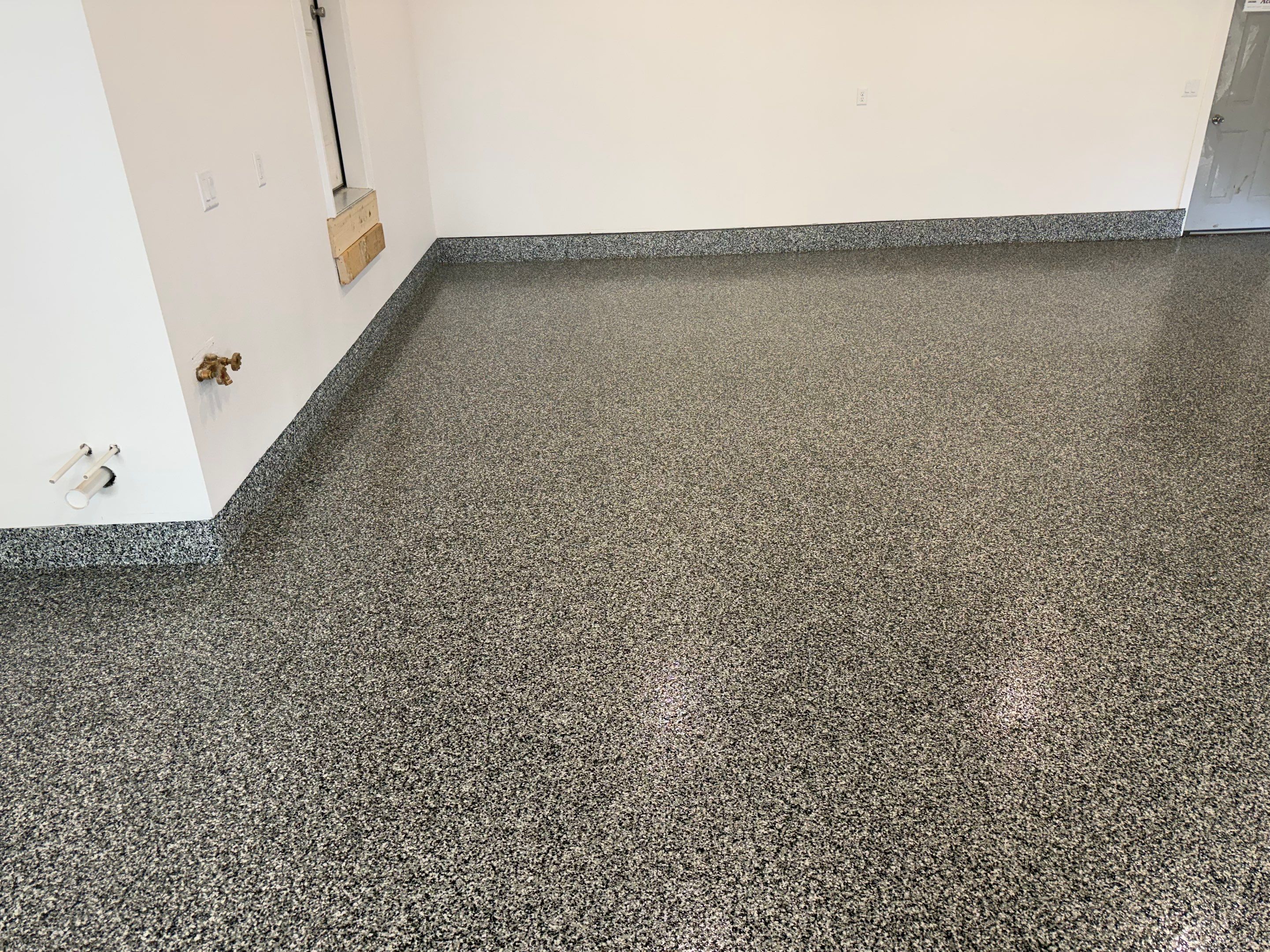 Multi-Car Garage Epoxy Floor Coating and Concrete Finishing in Sioux Falls by Select Painting, Coatings & Garage Cabinets