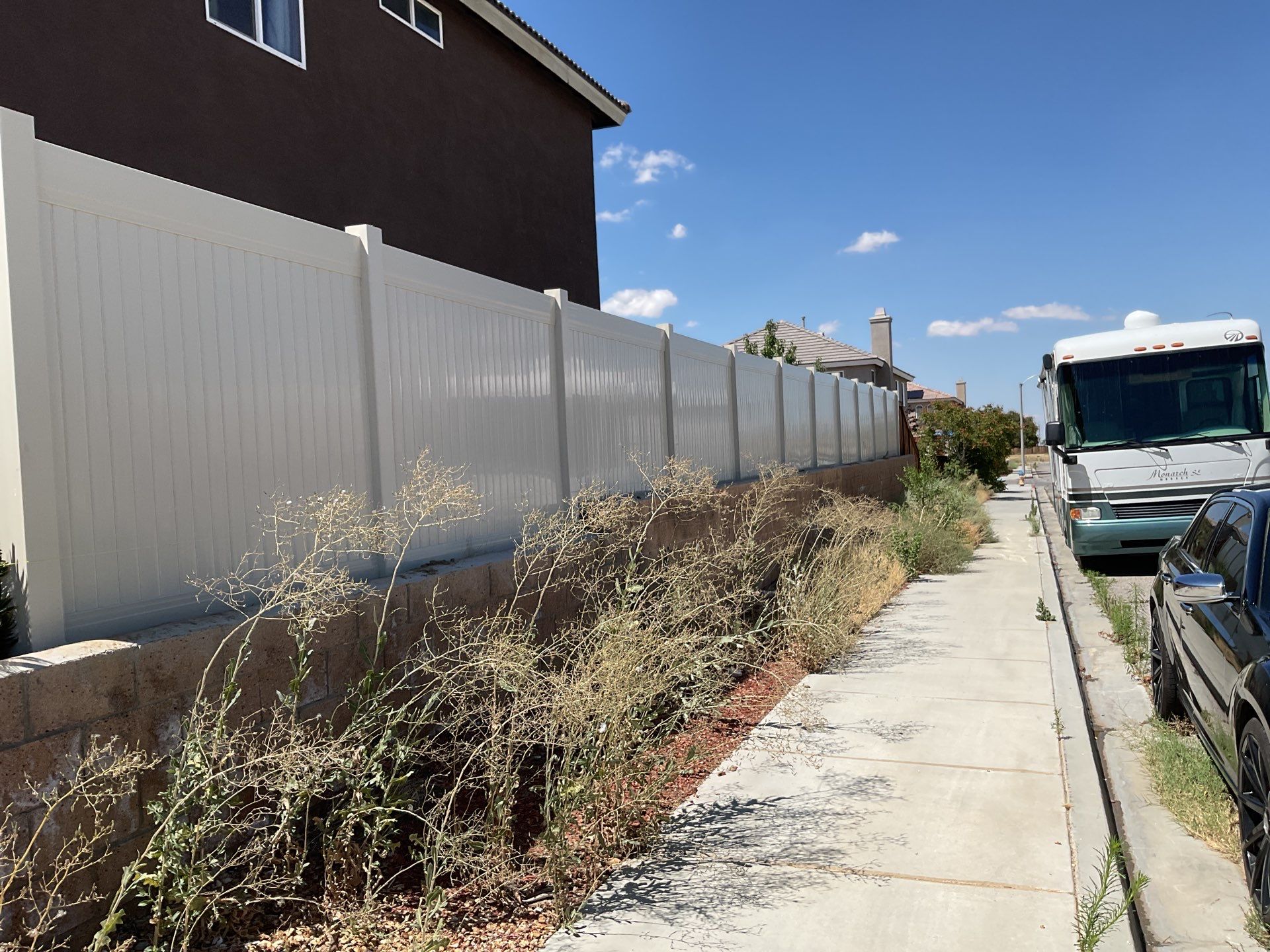Tan Vinyl by Fence Guys Inc. 