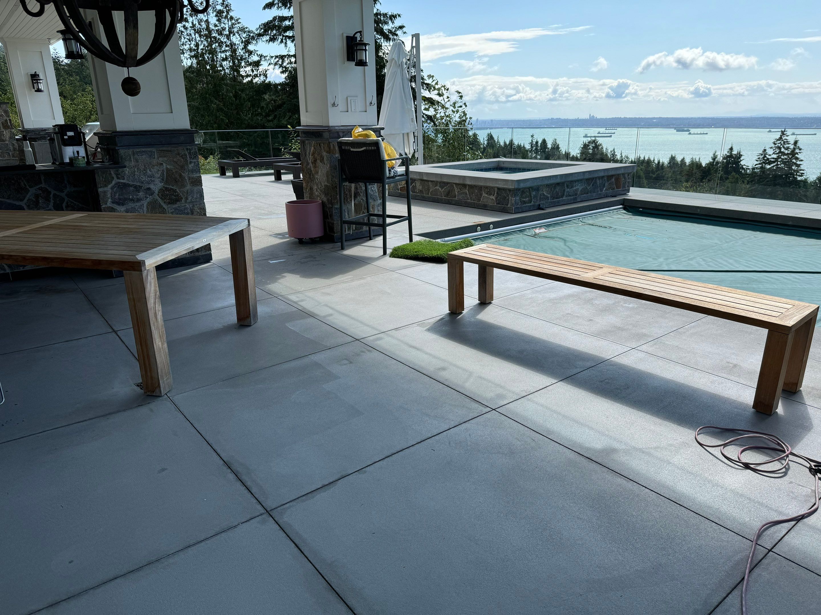 Applying Concrete Sealer  by YVR Construction Group