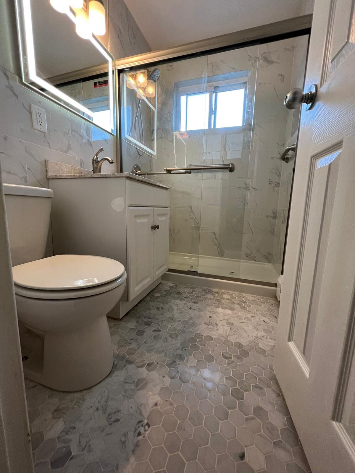 Bathroom Remodel using Tile by Home Concepts Construction
