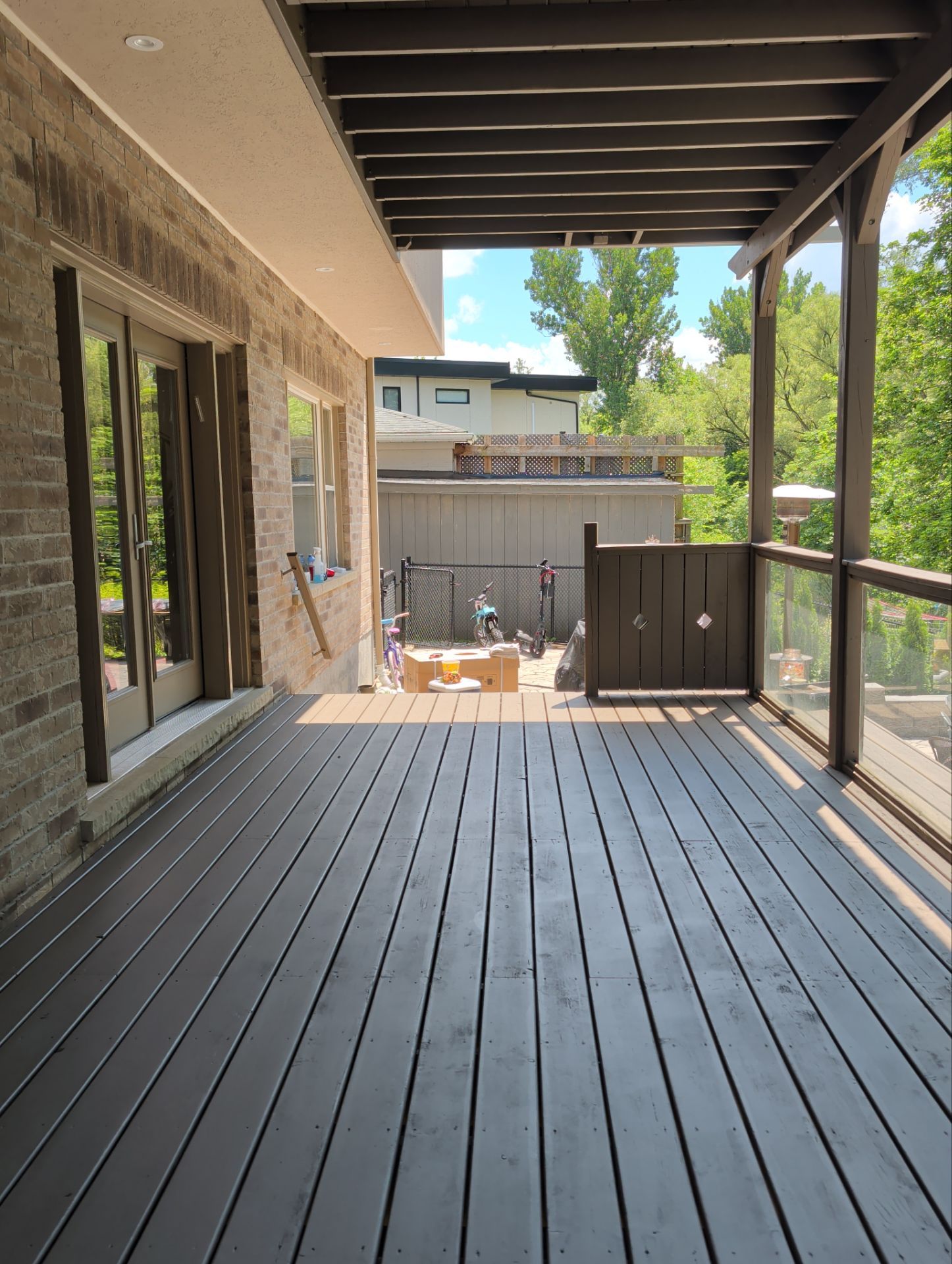 Multi-Level Deck Restoration and Glass Railing Installation in King by GTA HOME PAINTING