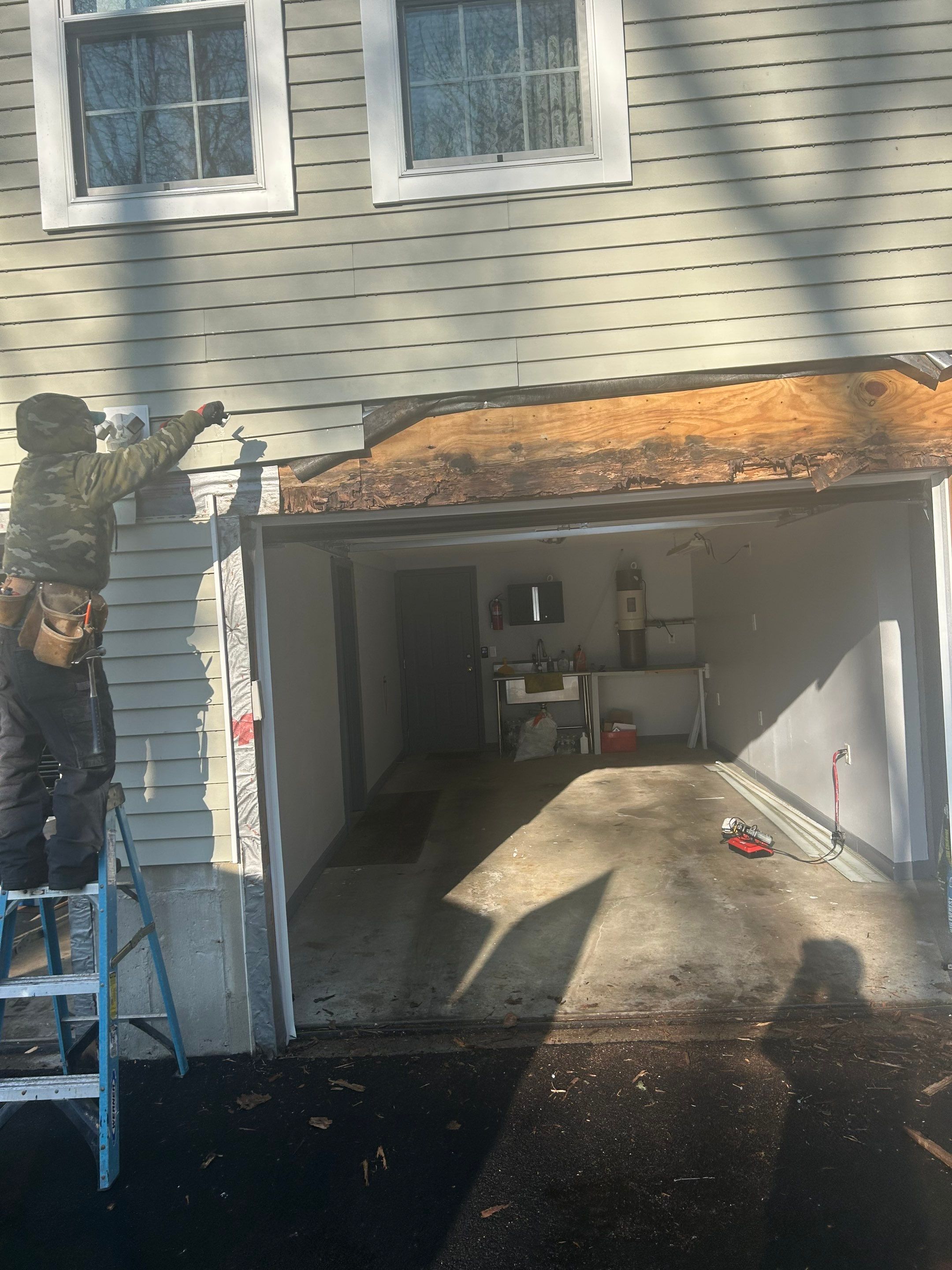 Garage Door Upgrade with Added Light & Detail by DiGiorgi Roofing and Siding Inc