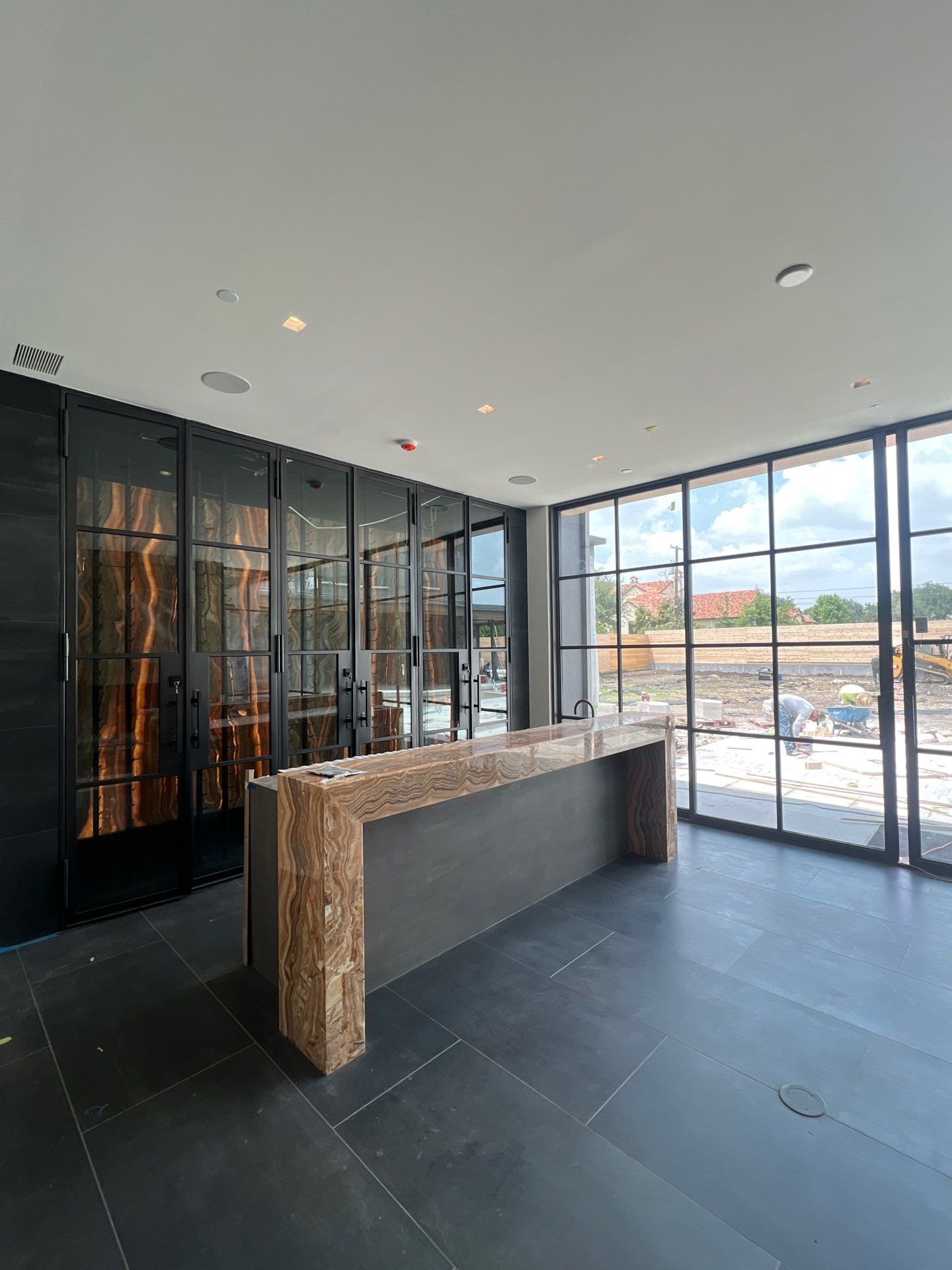 Custom Black-Framed Glass Wine Cellar Installation in Dallas by Solara Custom Living