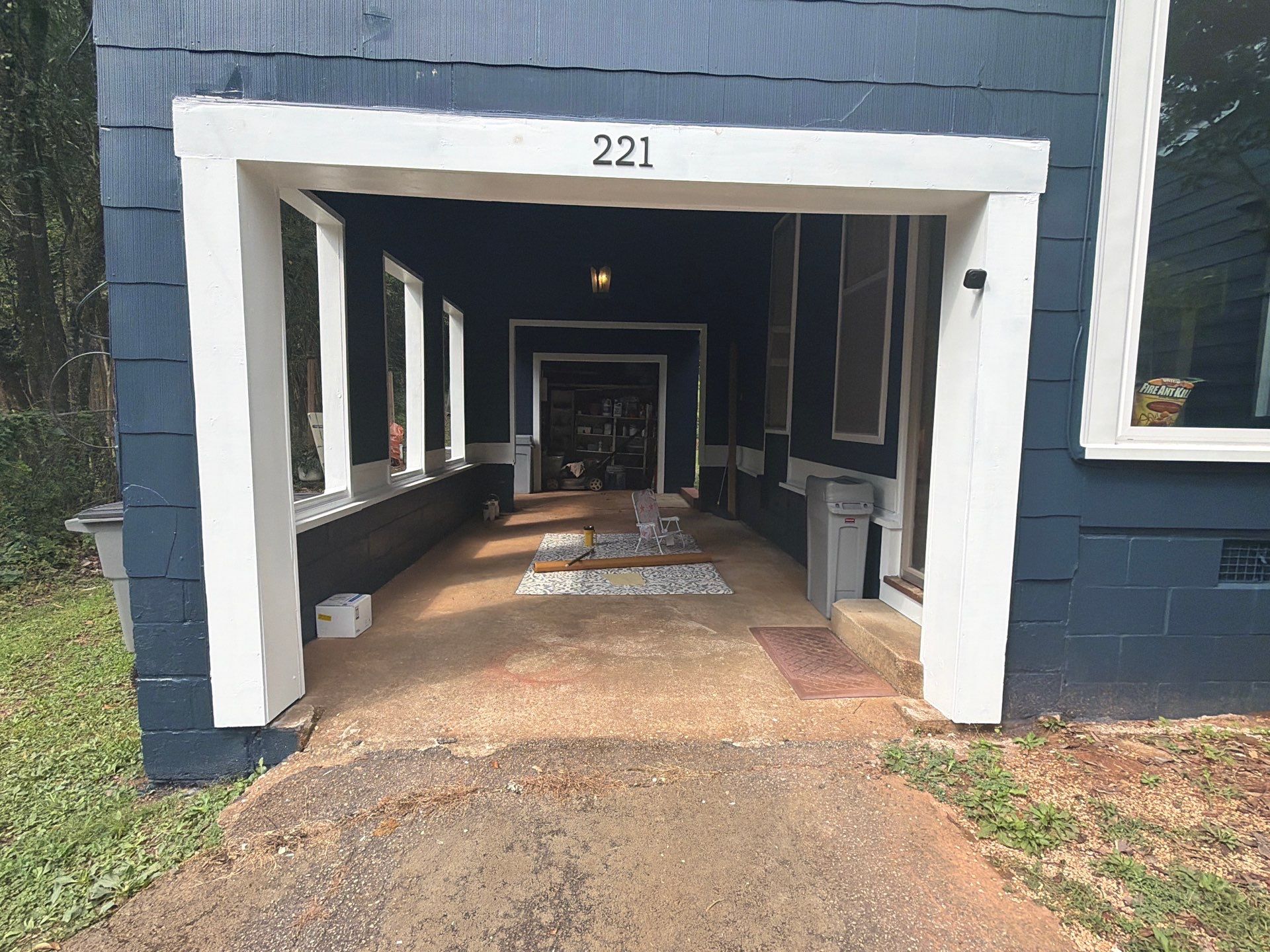 Full Exterior Repaint with Navy Blue and White Trim by Swift Home Renovations