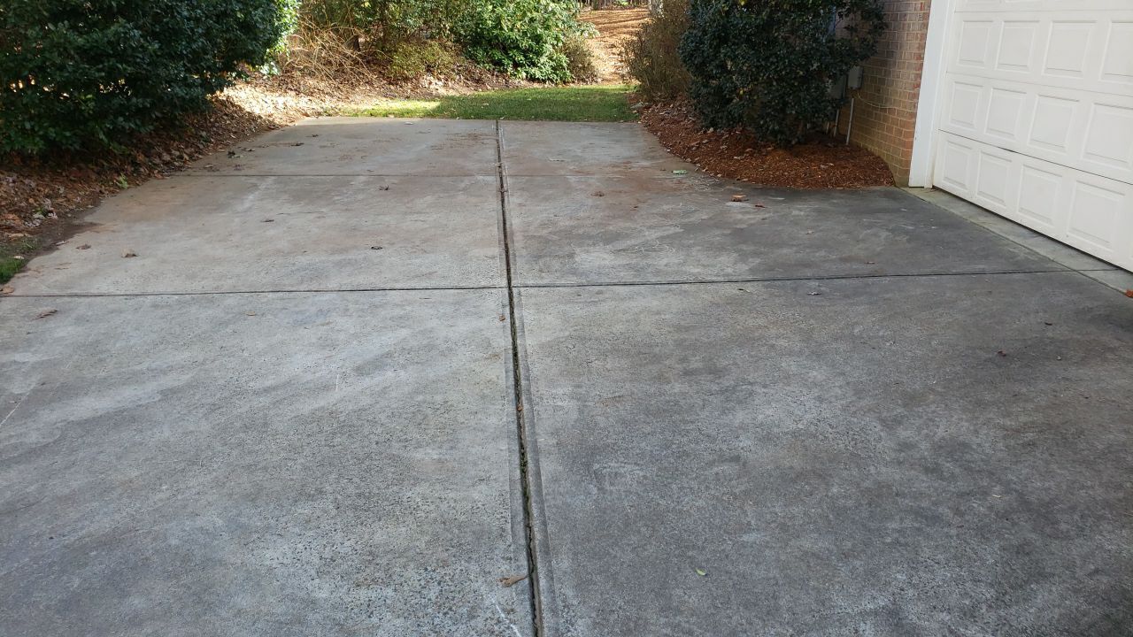 Driveway Clean using cleaner by Power Wash Masters LLC