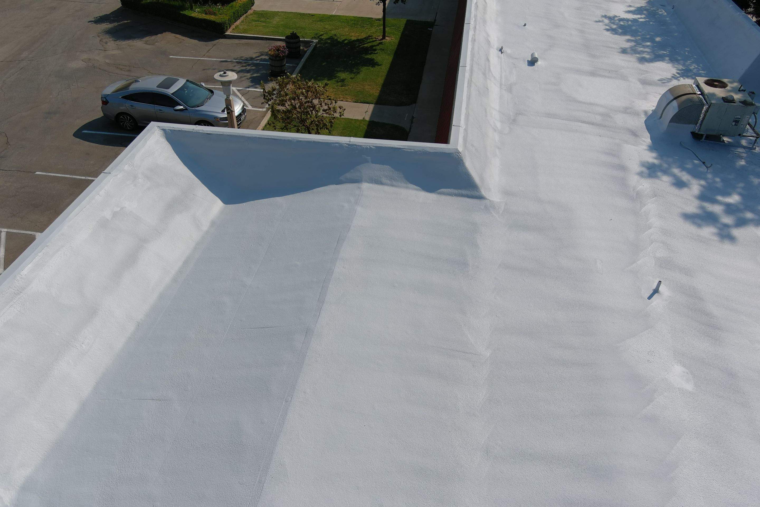 Commercial Roofing Installation using General Coatings acrylic coatings and spray foam by Straight Edge Roofing Inc
