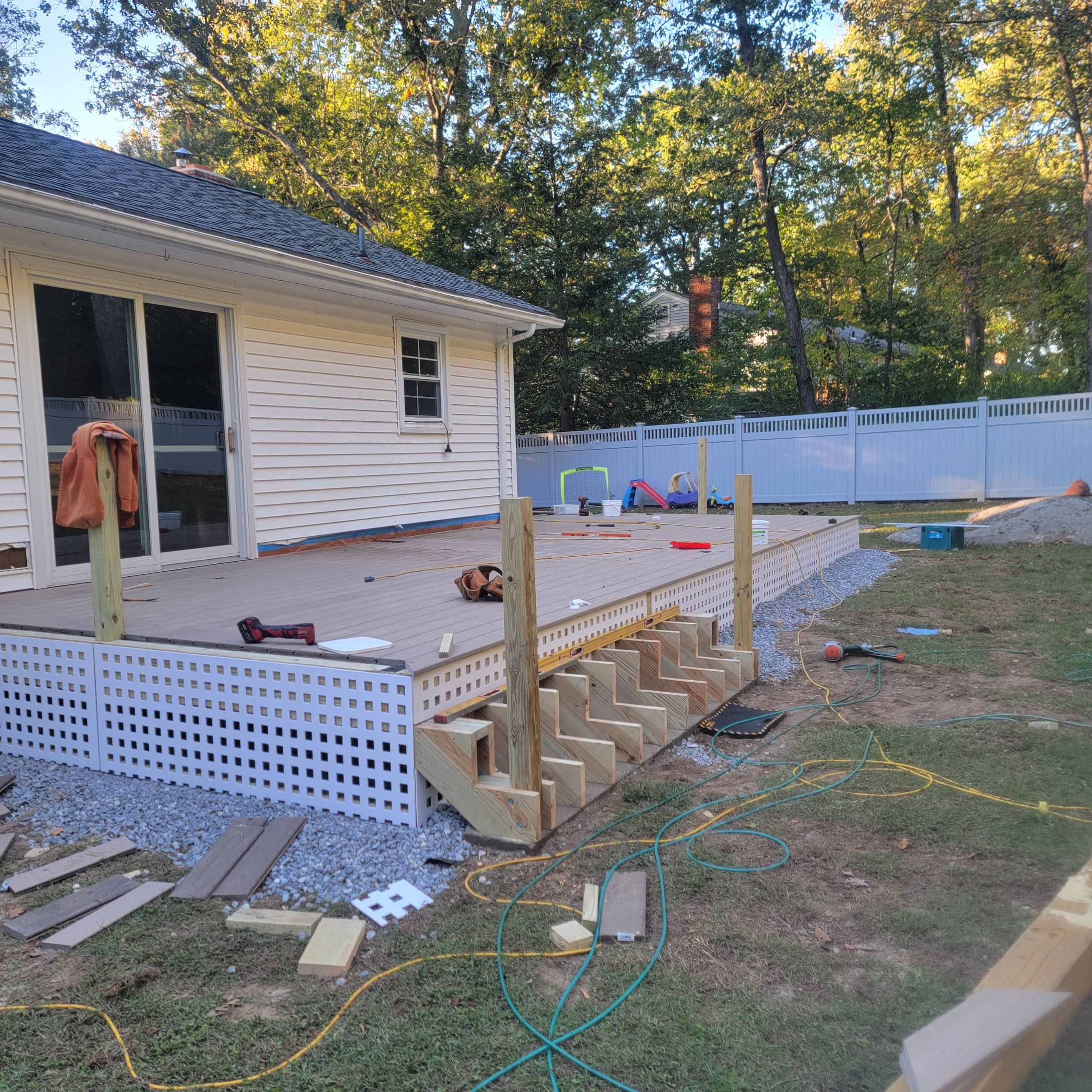 Deck replacement using Trex Transcend Rope swing and Transcend cocktail rail and trex lattice  by DiGiorgi Roofing and Siding Inc