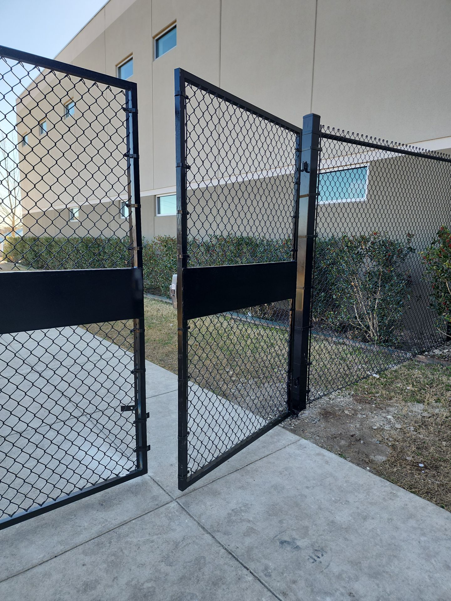Commercial Fencing - Black vinyl coated Chain link Fence by 3:16 Roofing and Construction