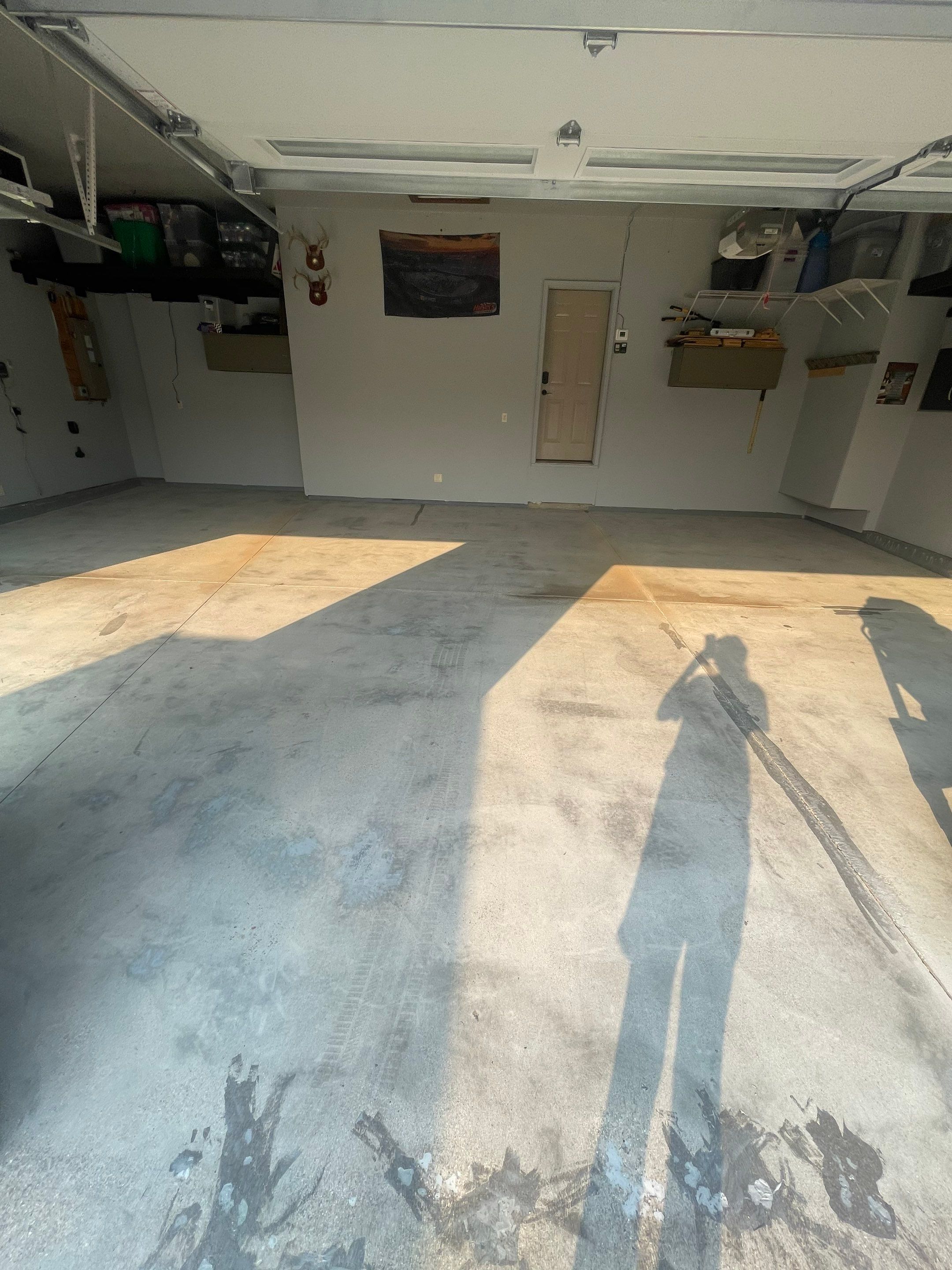 Sioux Falls Garage Concrete Coating Installation with Domino Flake by Select Painting, Coatings & Garage Cabinets