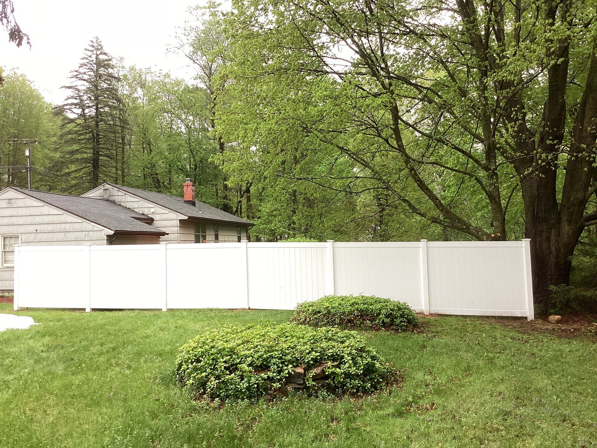 New White Vinyl privacy fence  by DiGiorgi Roofing and Siding Inc
